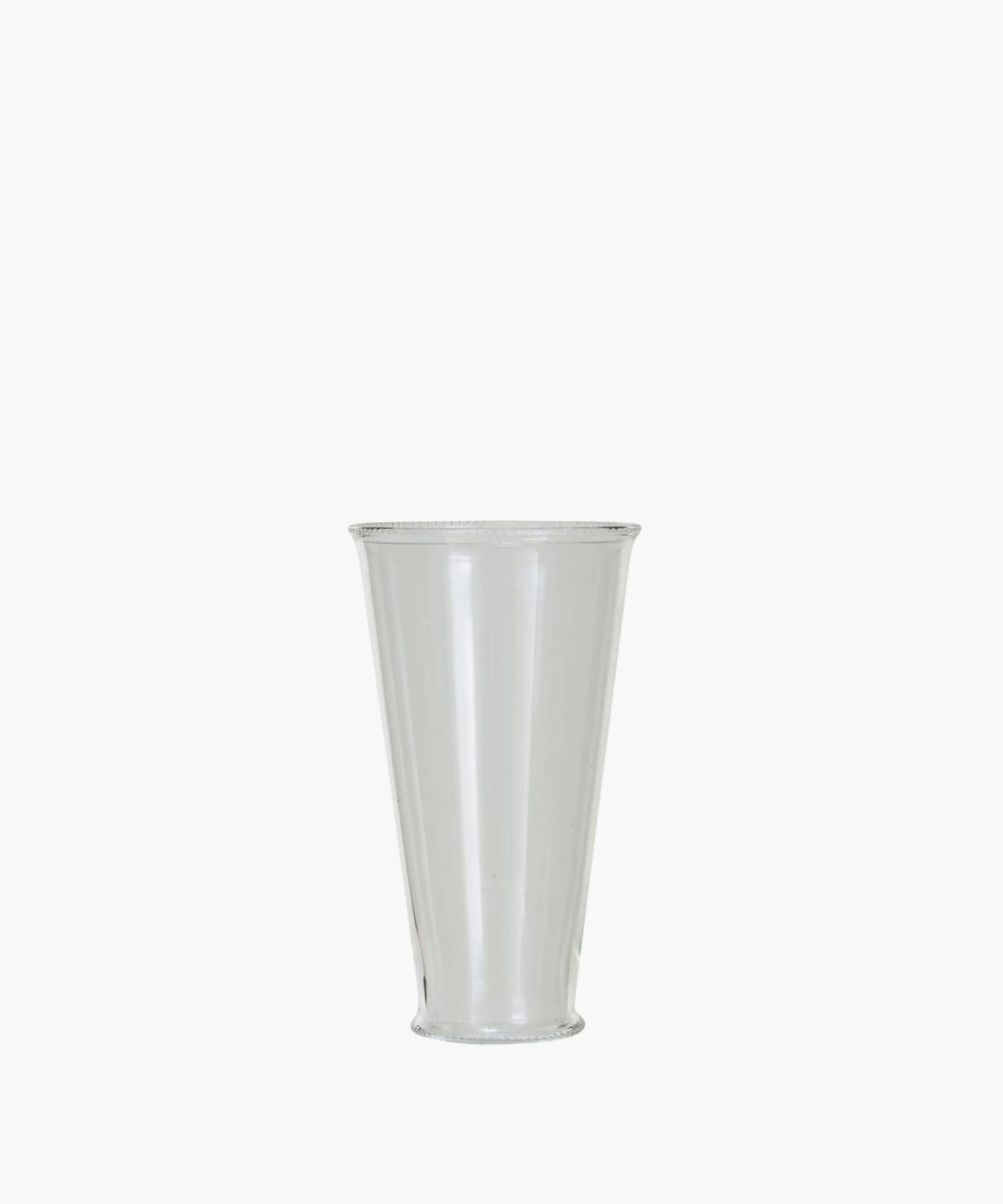 A clear, cylindrical drinking glass with a slightly flared rim. The simple design and transparent material create an elegant and minimalist appearance. | SW Home