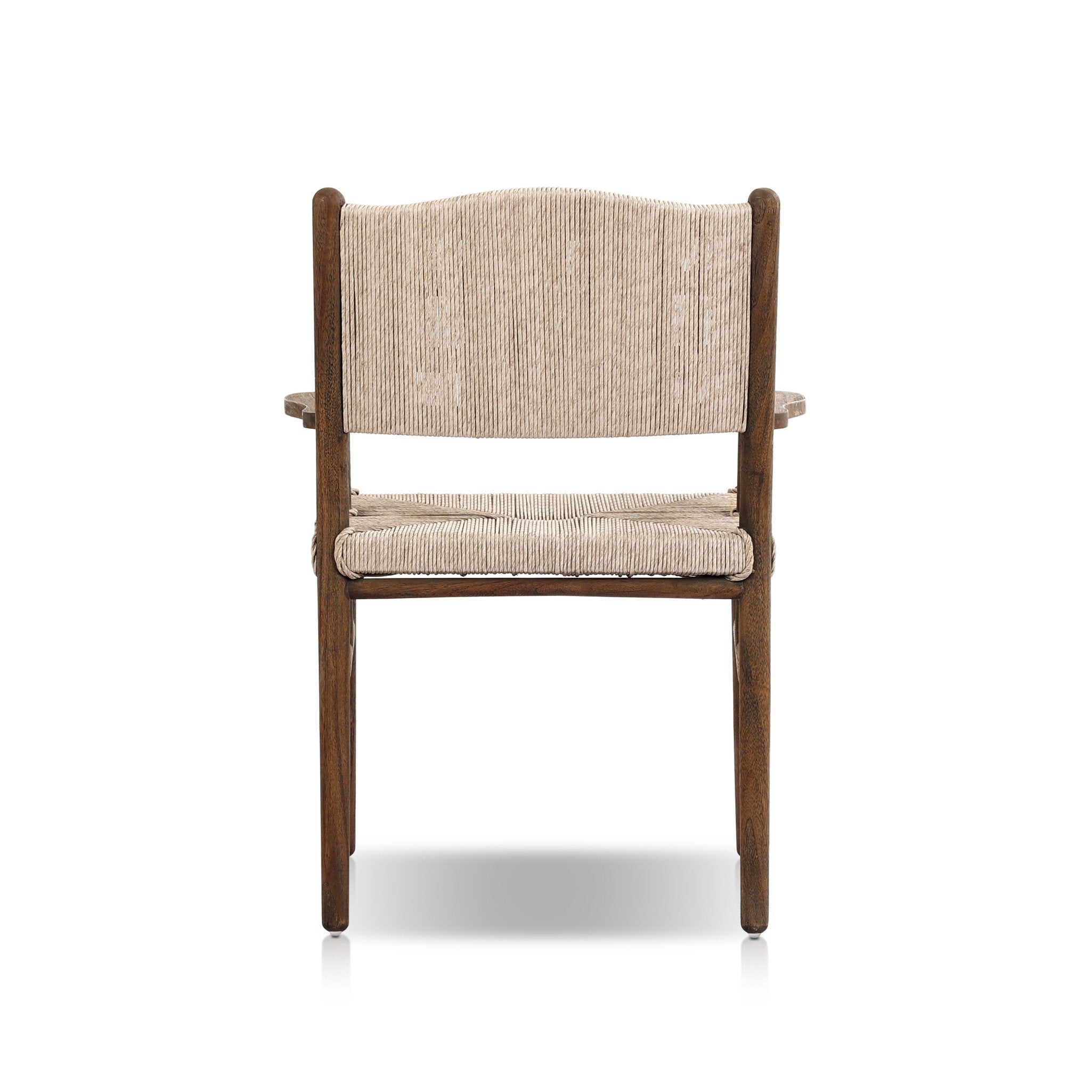 The back of a shaker style outdoor dining armchair with a dark brown wood frame and light brown woven seat and back on a white background. 