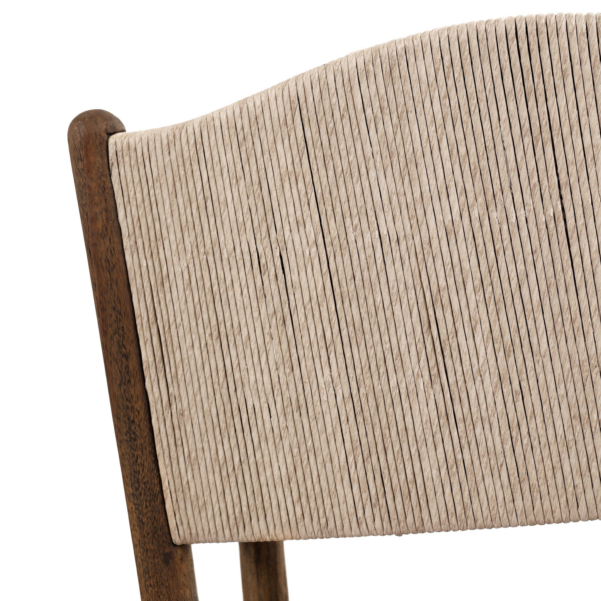Close up of the woven pattern from the back of the outdoor dining armchair. 