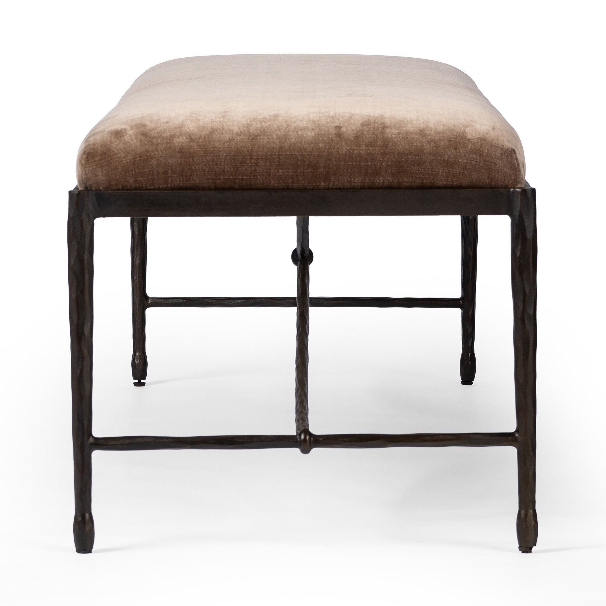 Side profile of a brown upholstered bench with black metal frame on a white background. 