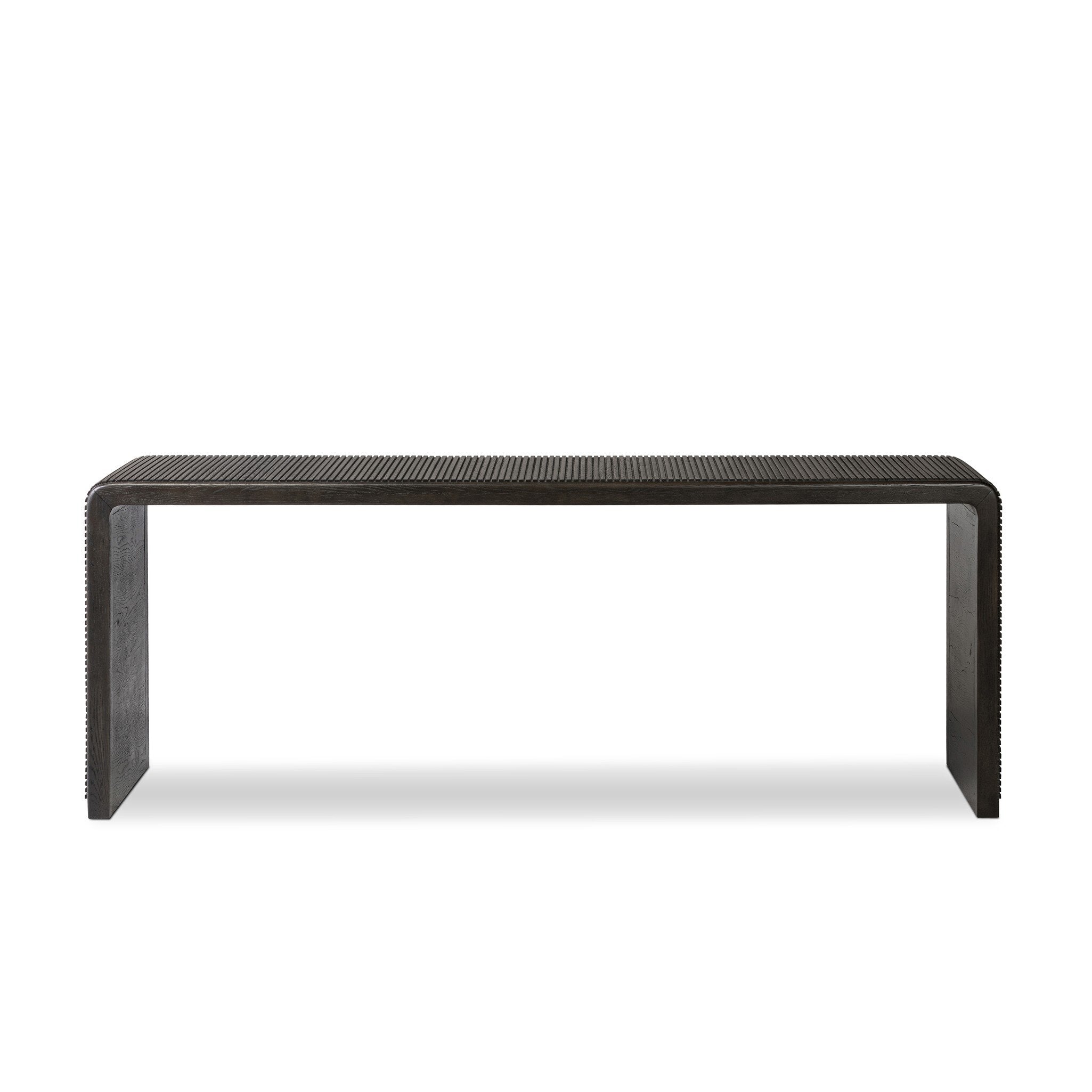 Smoked black oak console table with reeding and rounded edges on a white background. | S.W. Home