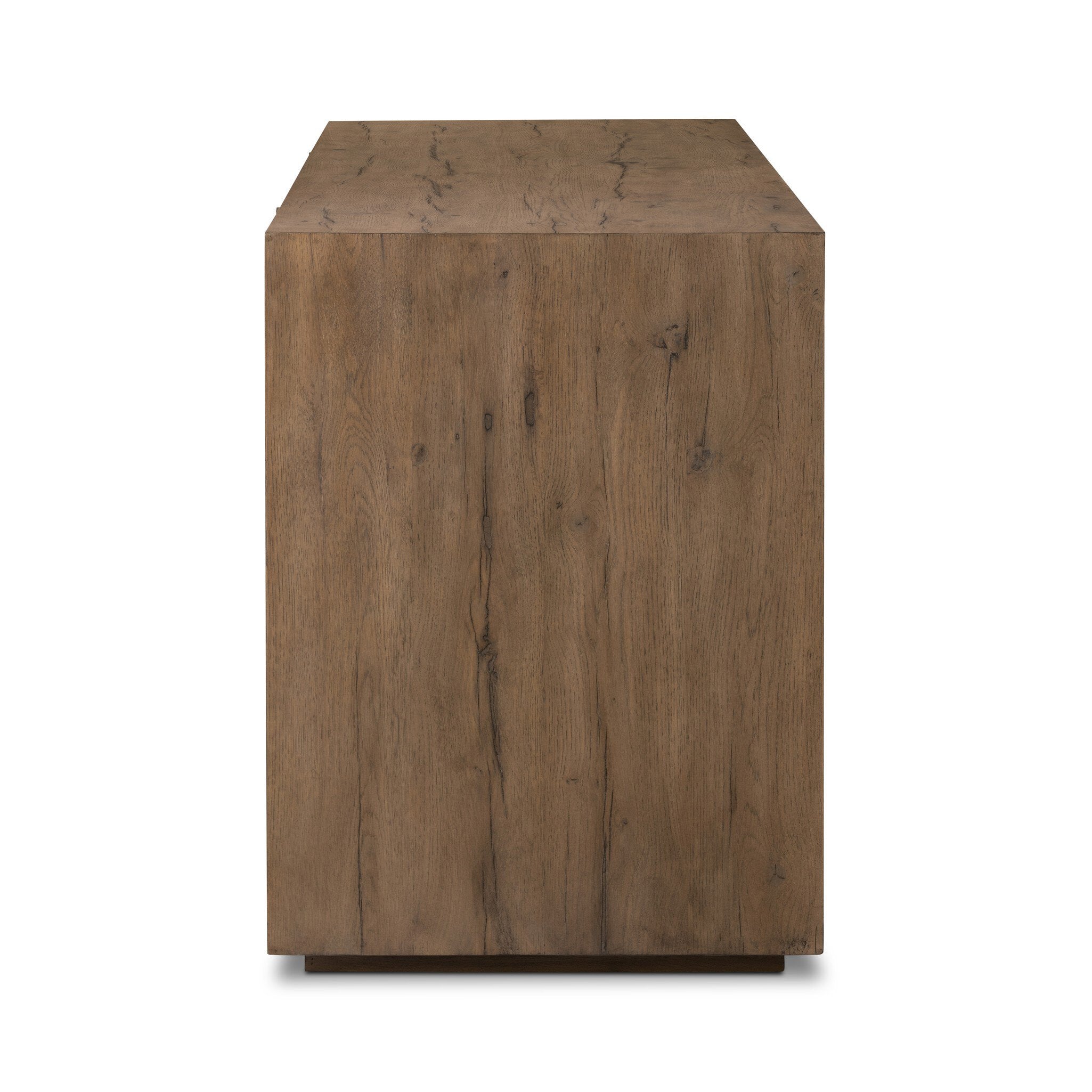 Side profile of a wooden sideboard with vertical reeding on a white background.