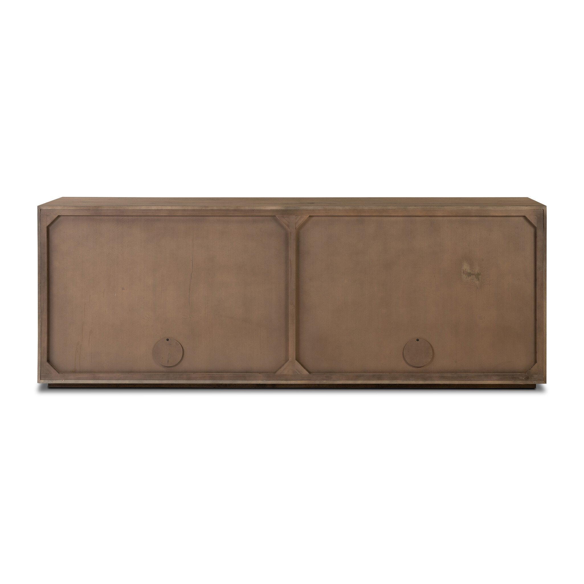 The back of a wooden sideboard with vertical reeding on a white background.