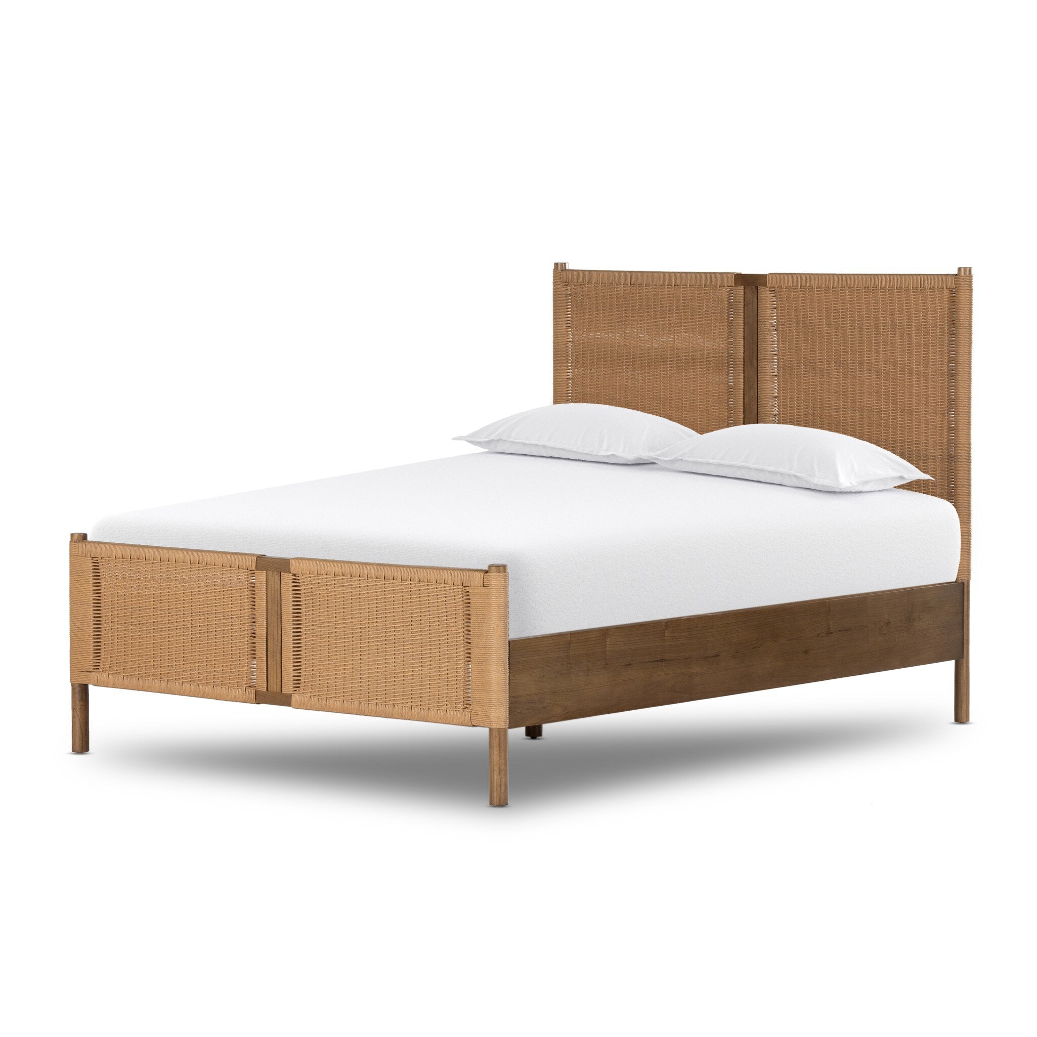 Wicker bed with white bedding on a white background.
