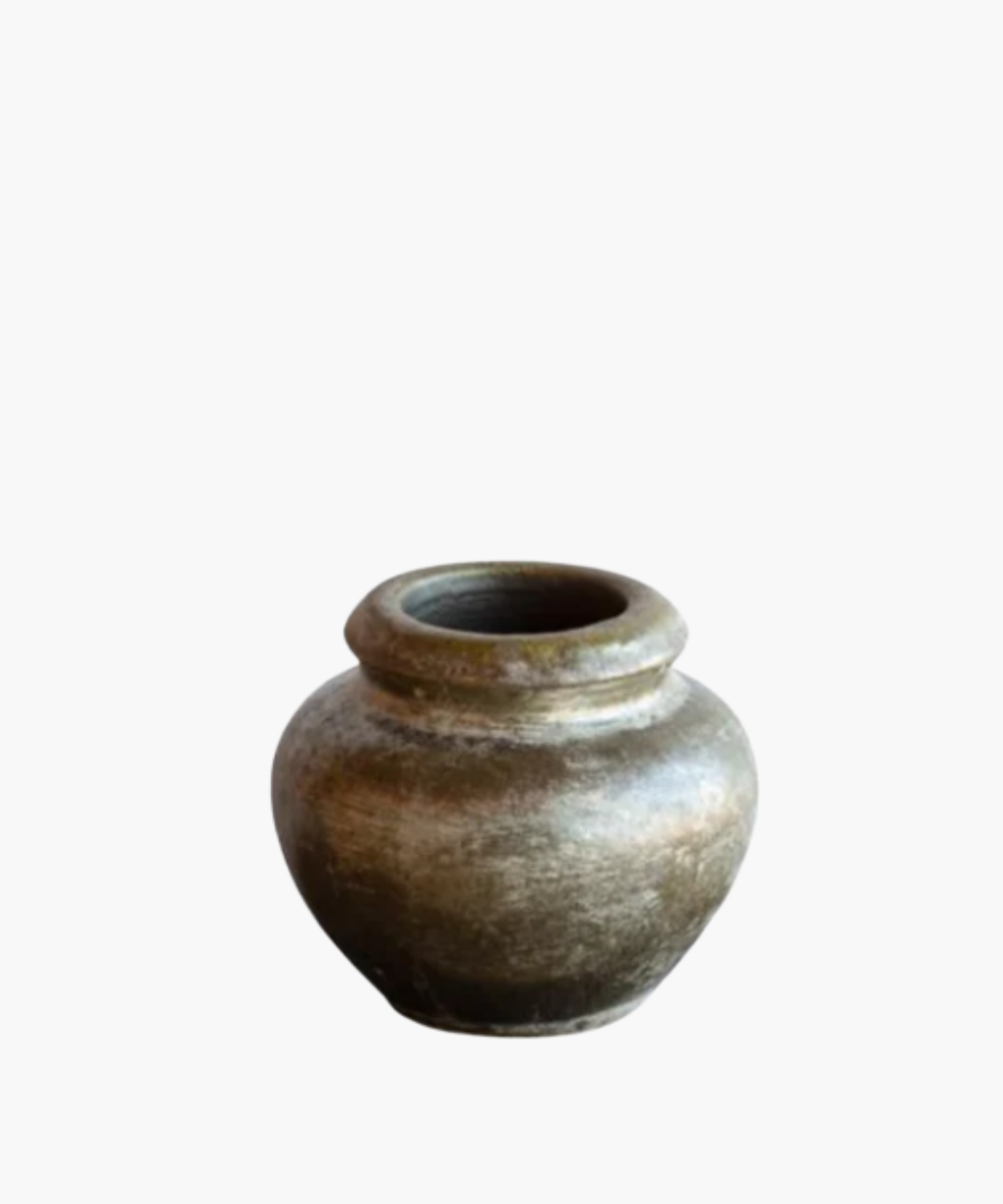 A rustic, weathered clay pot with a rounded body and a narrow opening, showcasing earthy tones and a textured surface, evoking a sense of antiquity. | S.W. Home