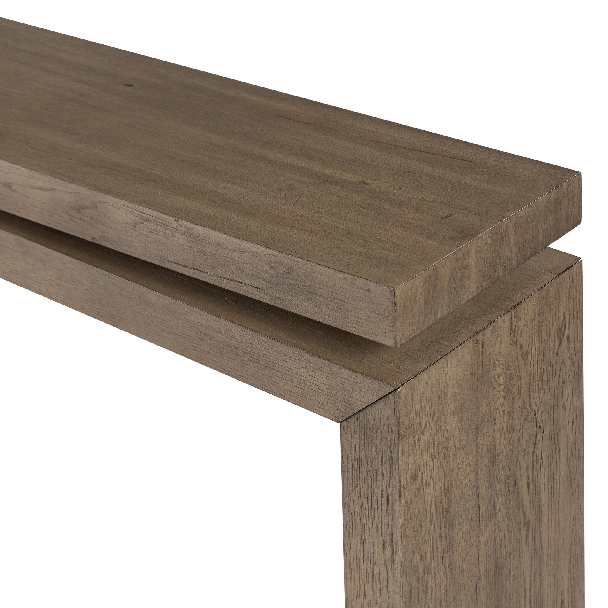 Close up of a wooden console table with a curved design on a white background.