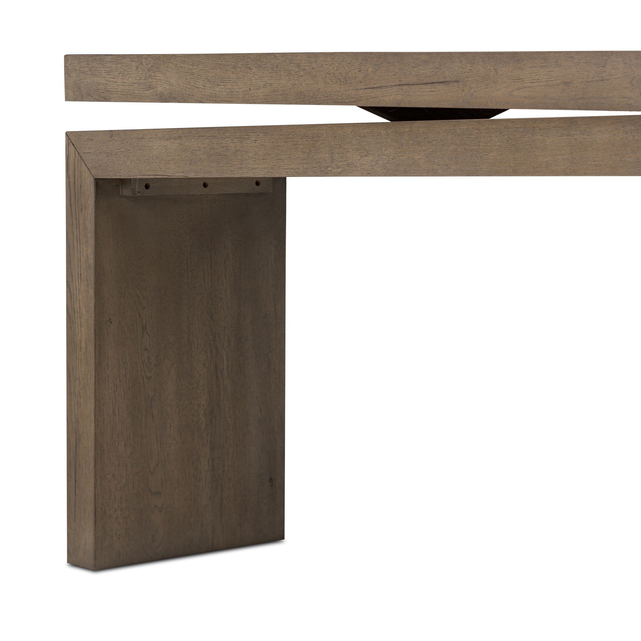 Close up of a wooden console table with a curved design on a white background.