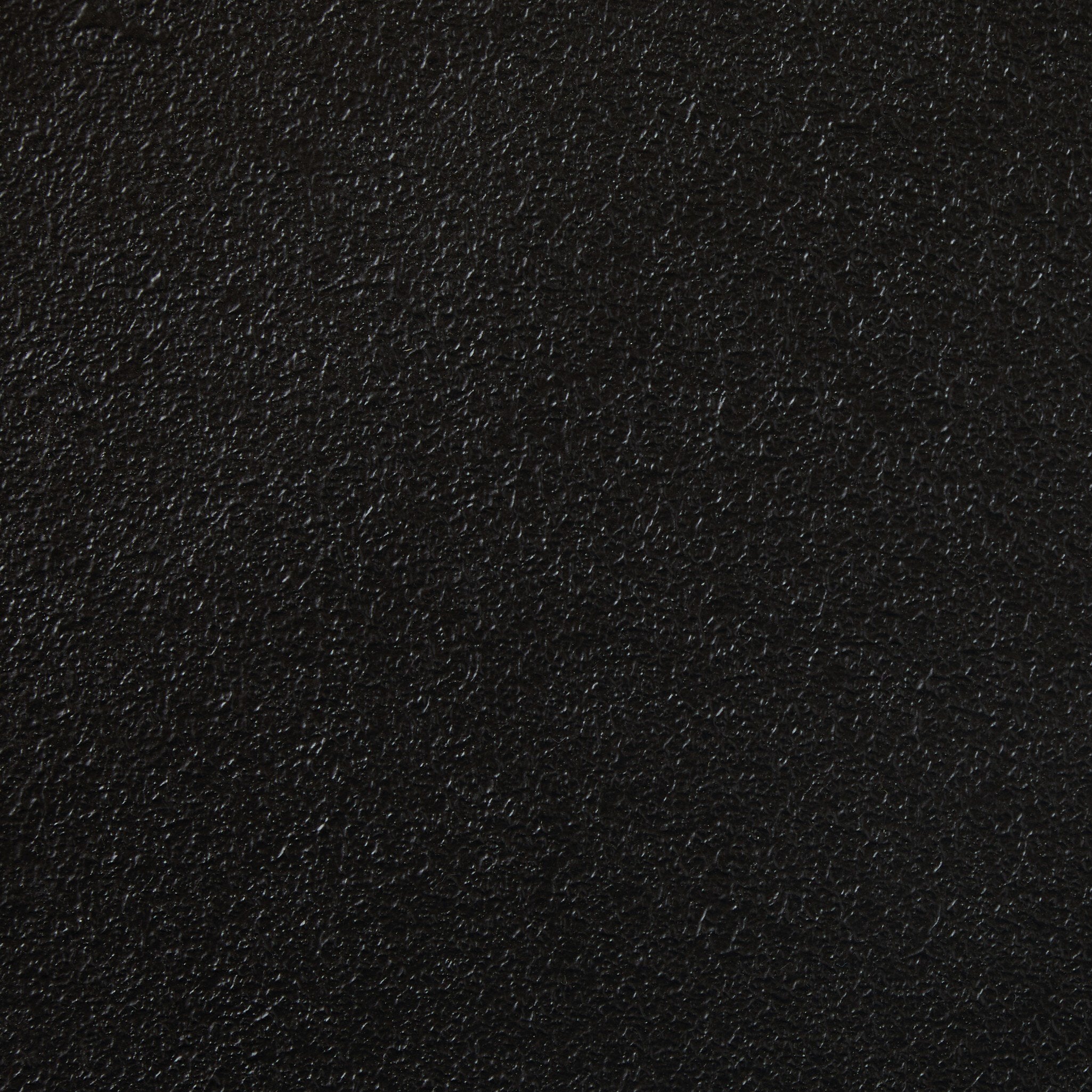 Close up picture of the textured black iron table top. 