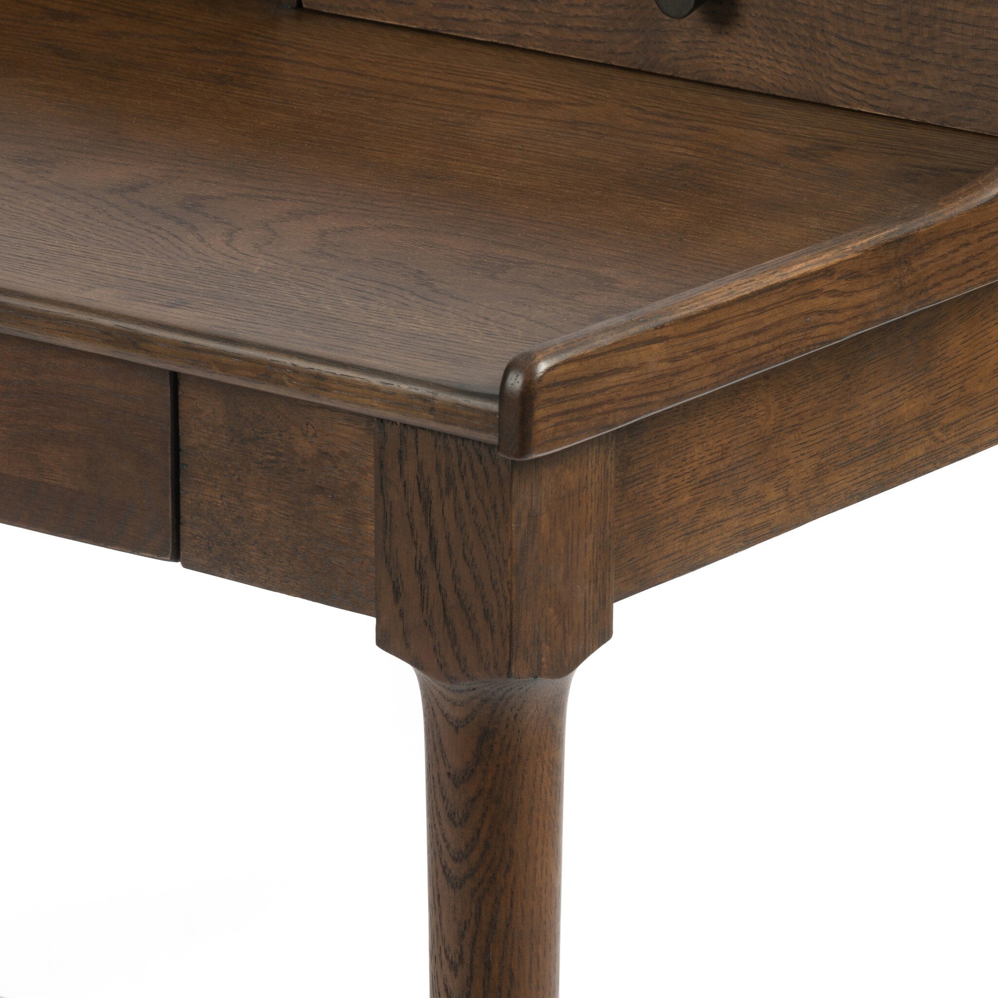 Close up of a wooden desk with drawers on a white background.