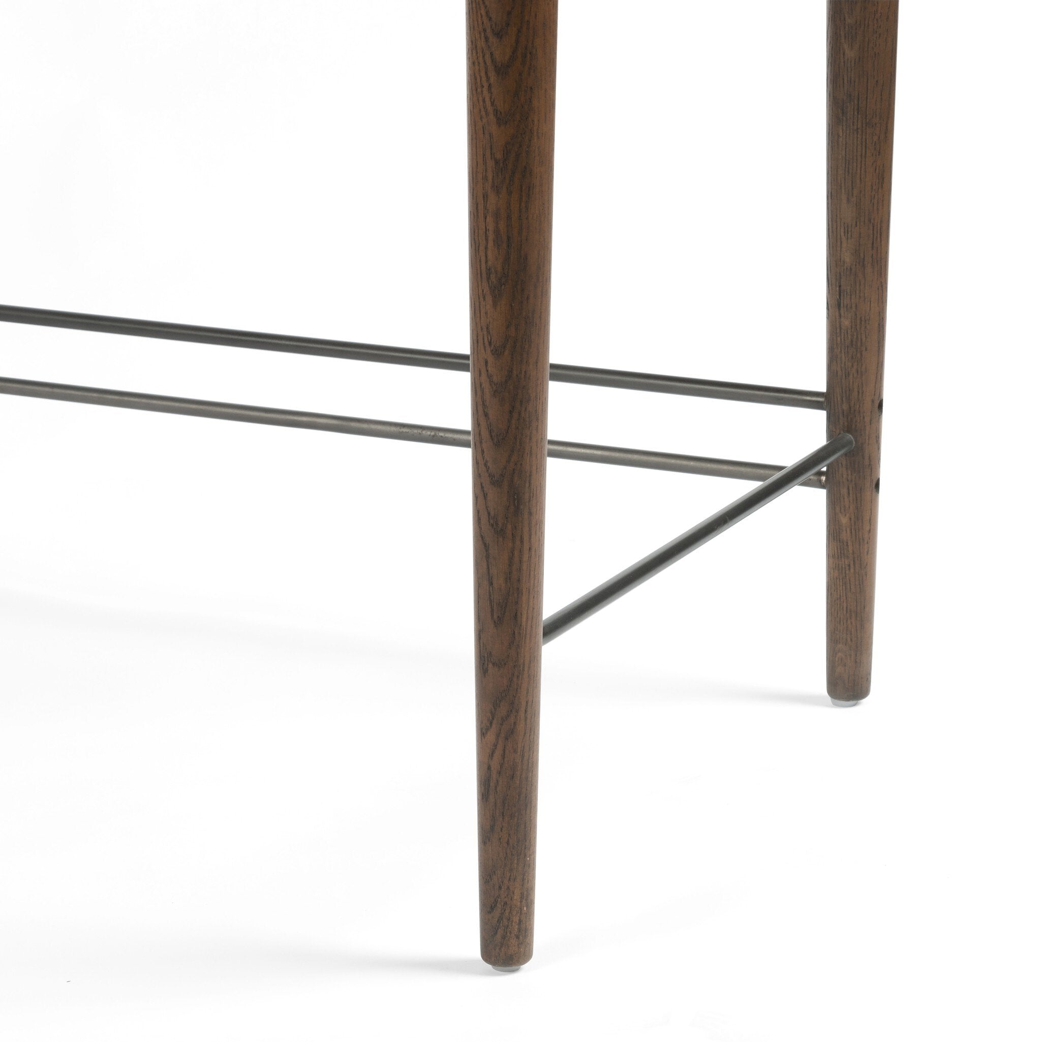 Close up of a wooden desk with drawers on a white background.