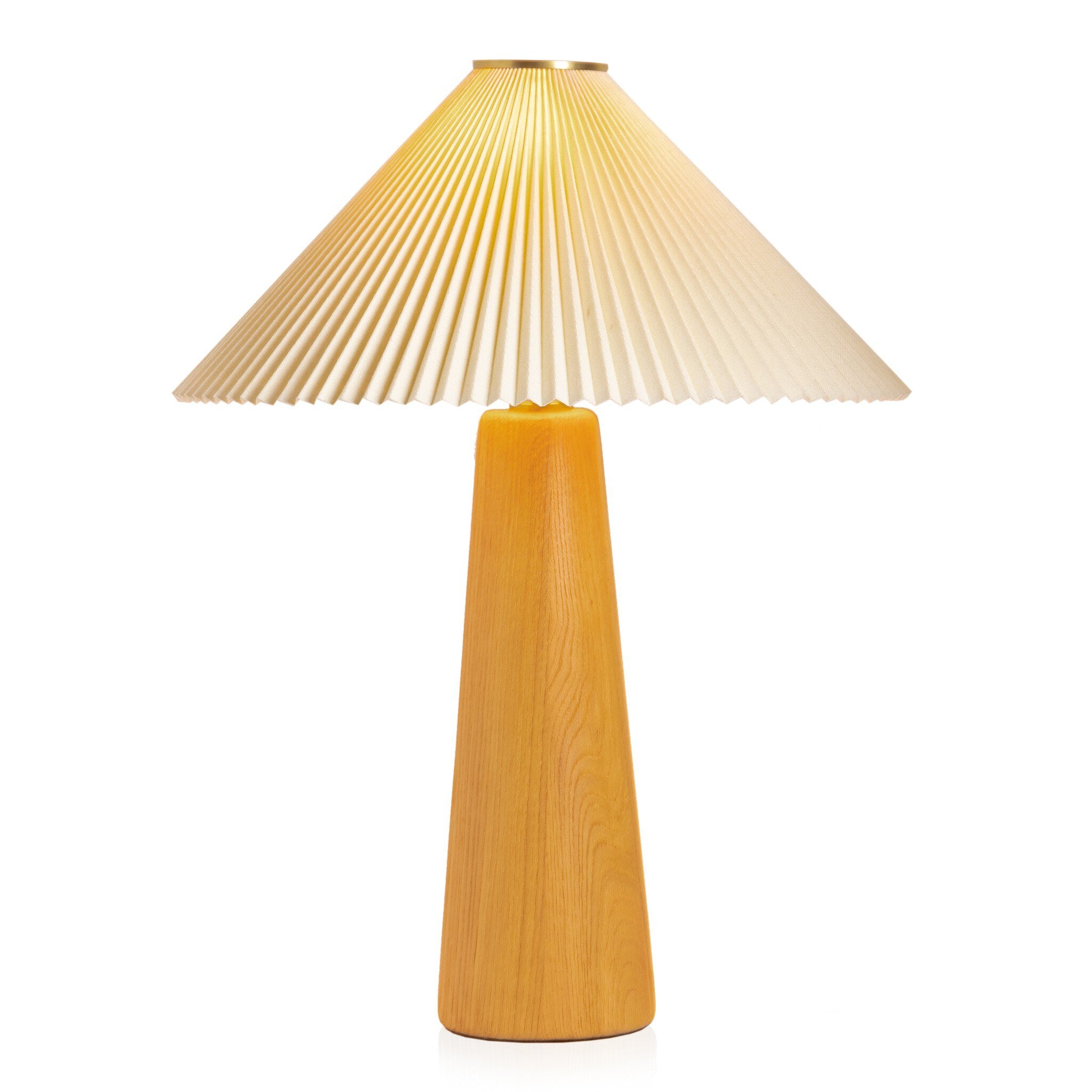 Table lamp with pleated white shade and wooden base on a white background.