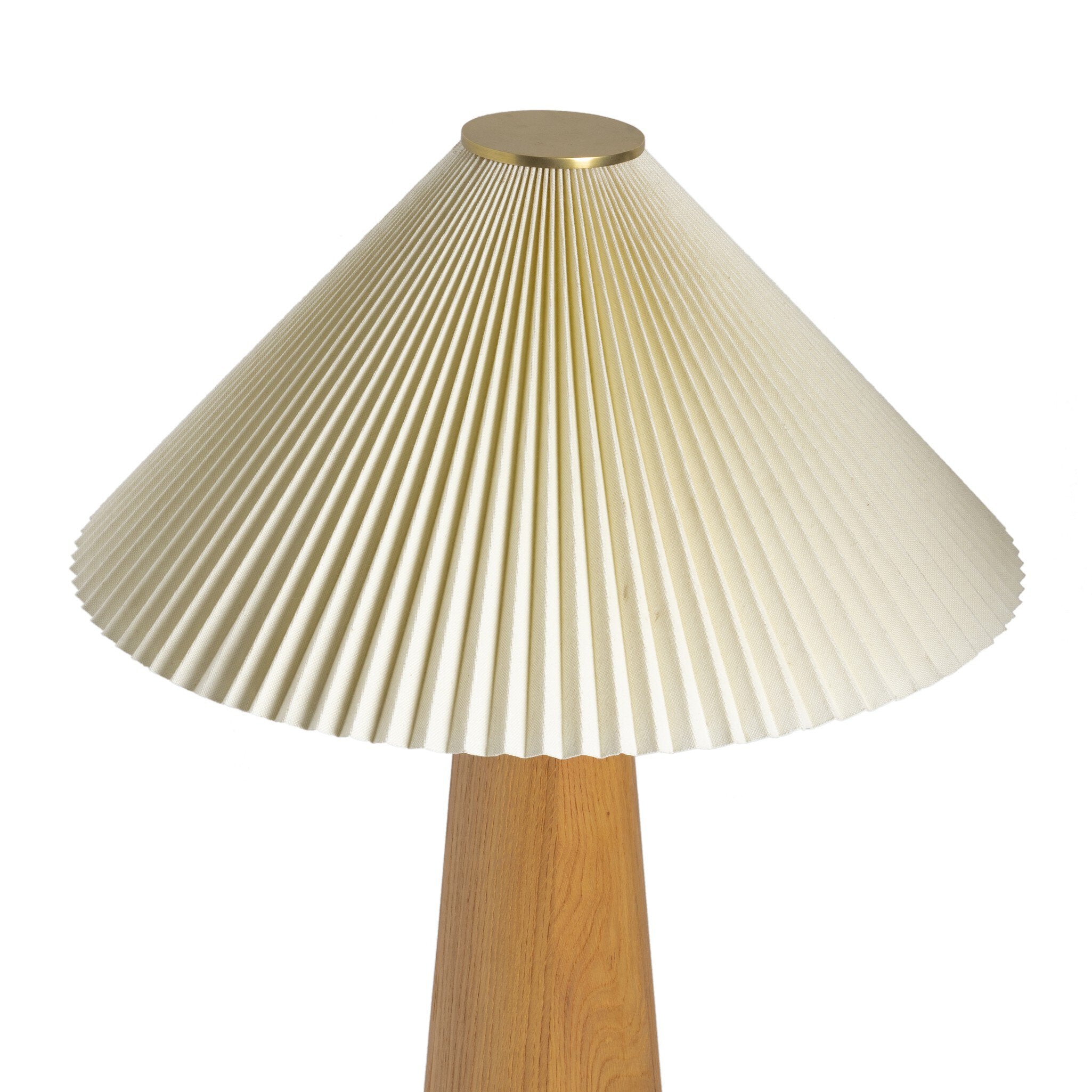 Table lamp with pleated white shade and wooden base on a white background.