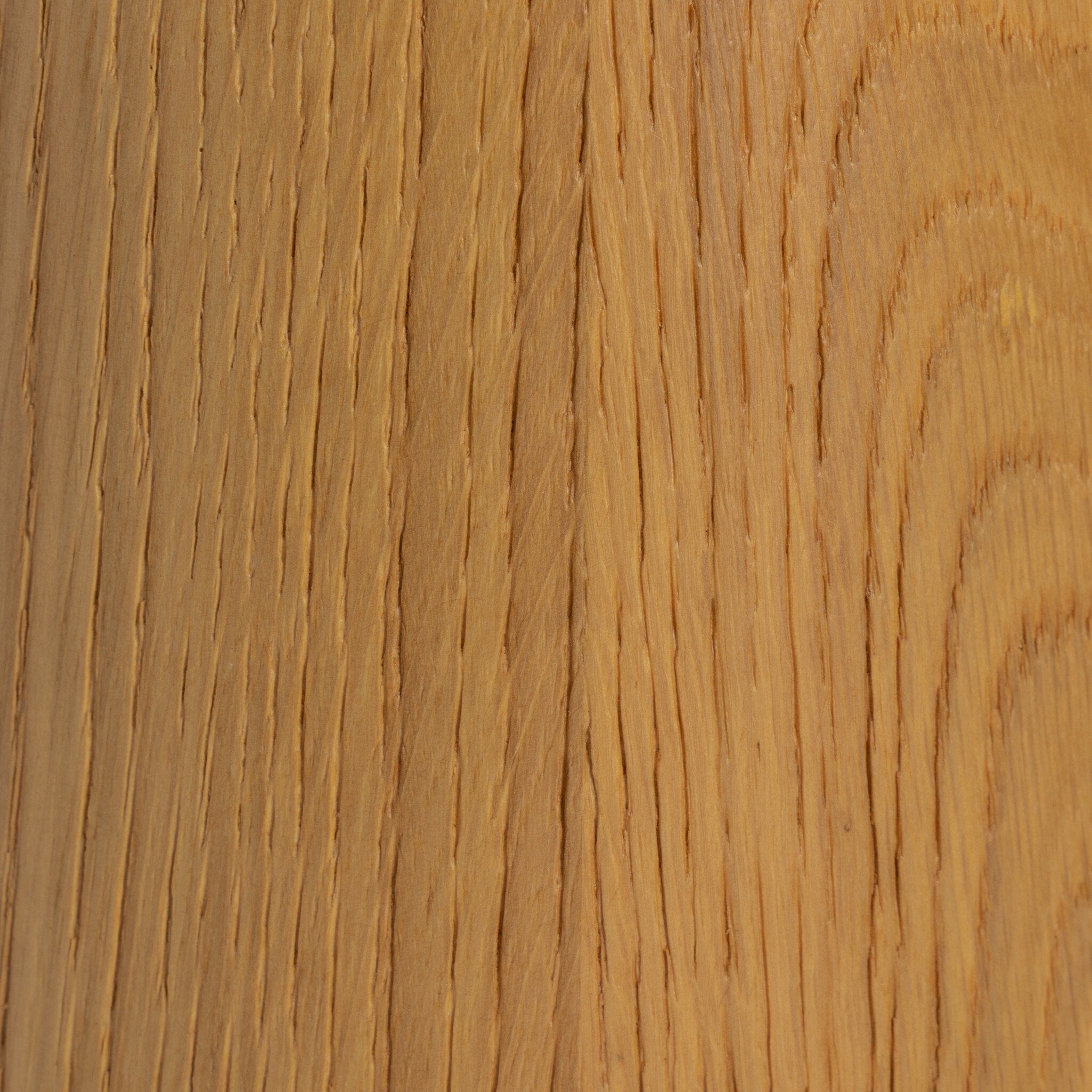 Close up of the wood lamp base showing its color and wood grain. 