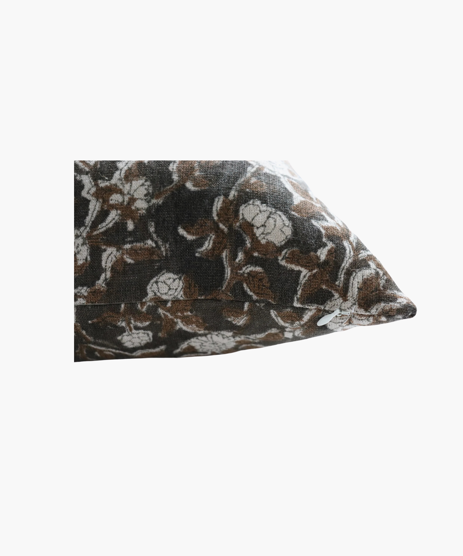 A detailed picture of a rectangular pillow  highlighting its  floral pattern of brown leaves and white flowers on a dark background. The design is intricate and evokes a cozy feel. | Wildwood Home Co.