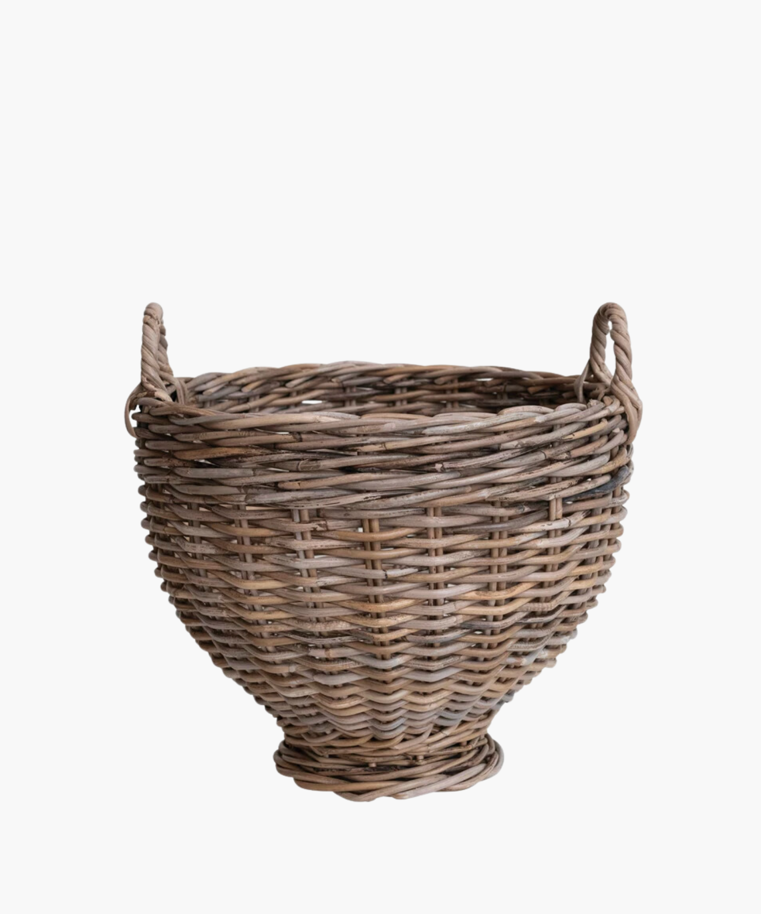 A handwoven round rattan footed basket with two small handles, featuring a natural brown tone. The basket has a rustic, handcrafted appearance, conveying a traditional and homely feel. | S.W. Home 