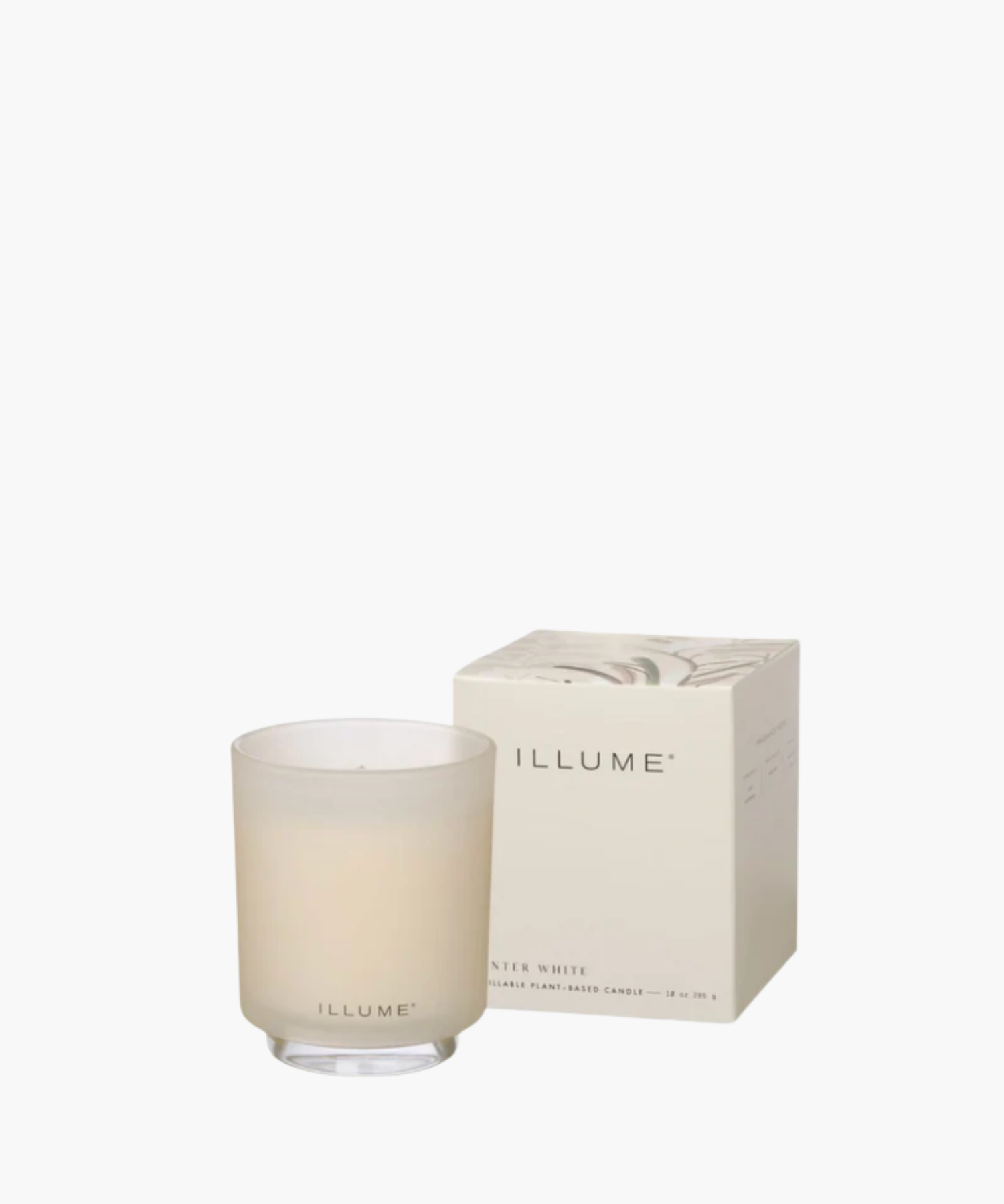 Frosted glass candle with "ILLUME" branding beside a matching decorated box. Soft, elegant design conveys a sense of calm and sophistication. | SW Home