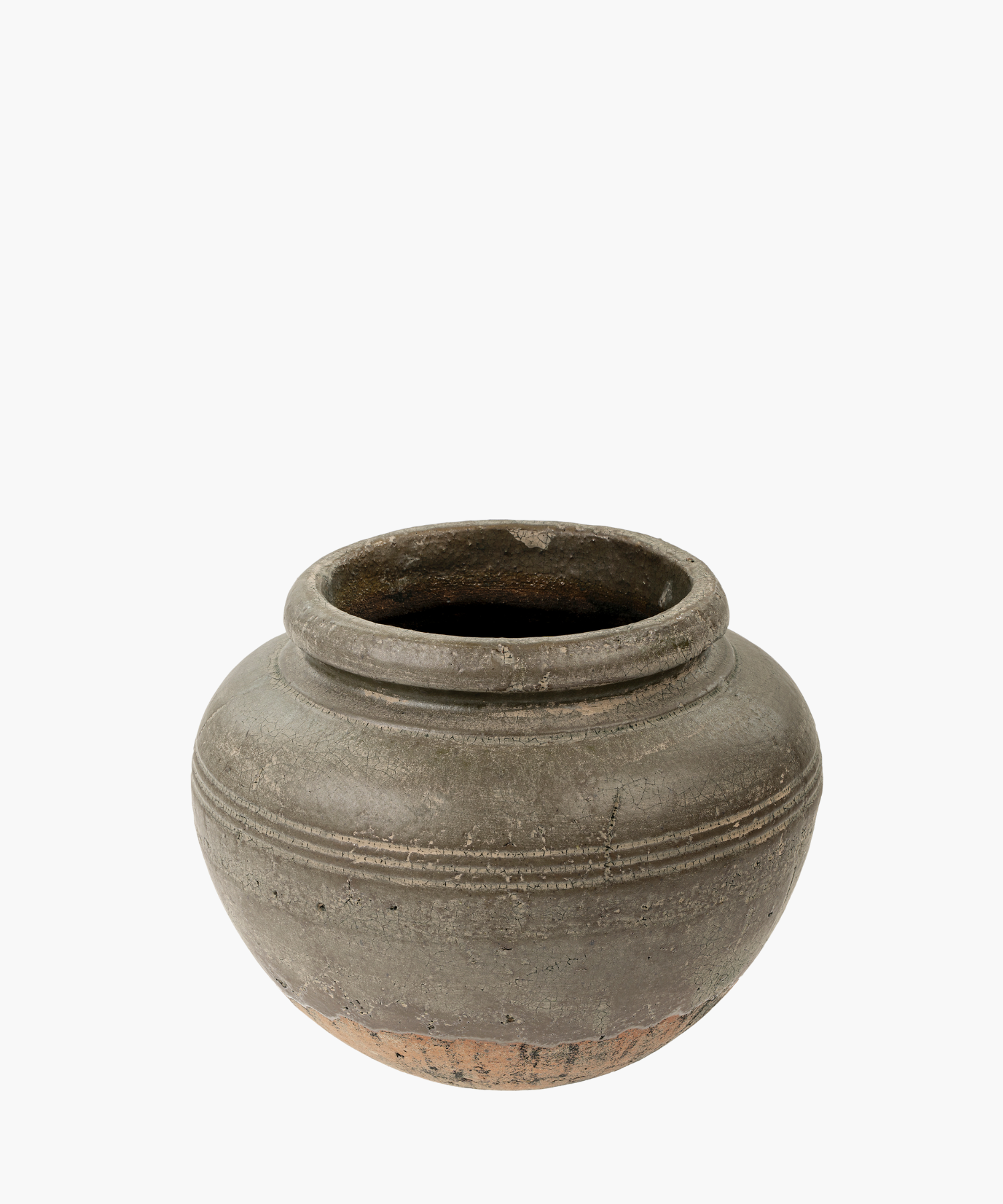A round, weathered clay vase with a wide opening and decorative horizontal ridges. The vase conveys an earthy, rustic, and historical feel. | S.W. Home