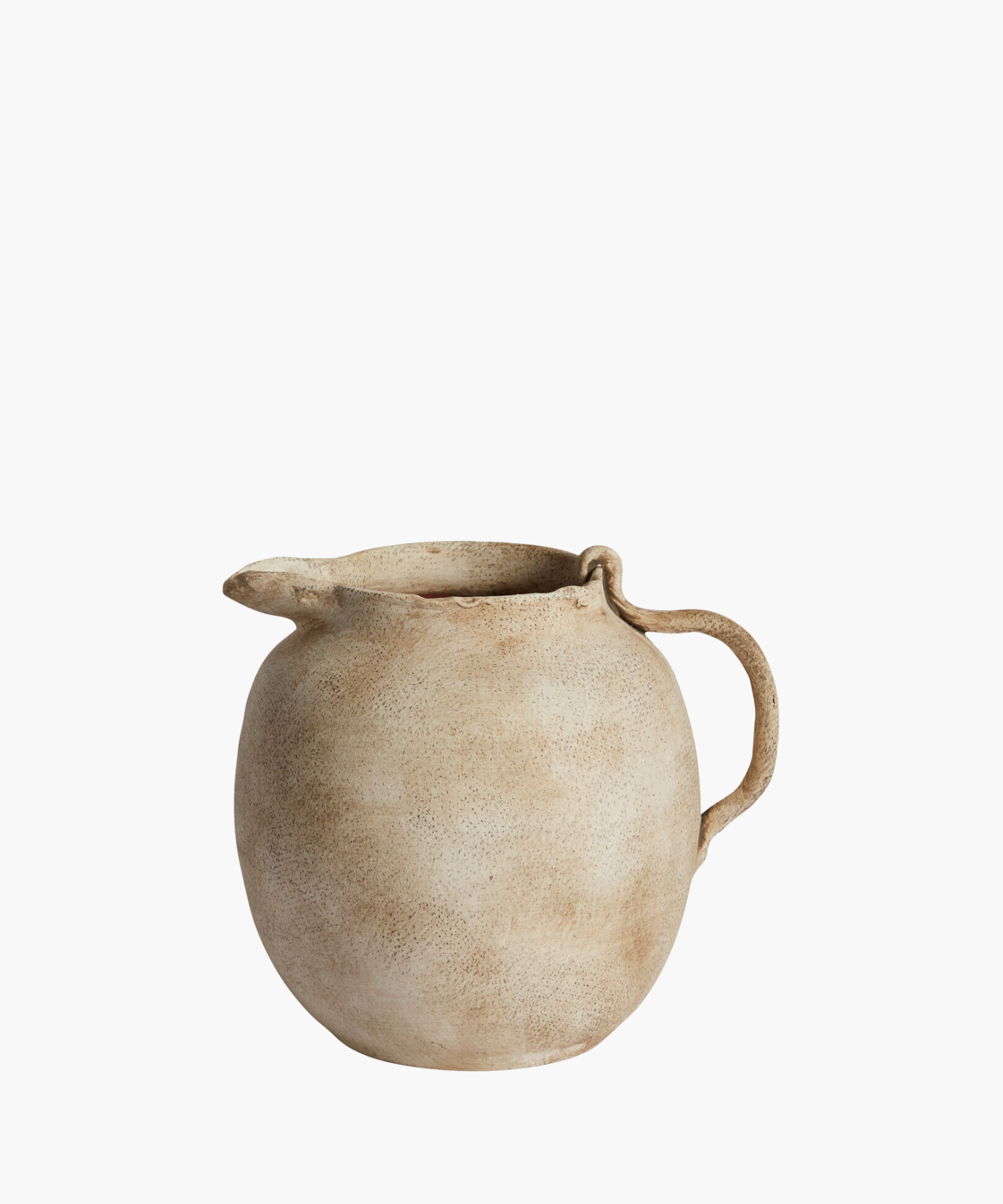 Rustic beige ceramic pitcher with a rounded body, textured surface, and curved handle. The design evokes a vintage, handcrafted feel. | S.W. Home