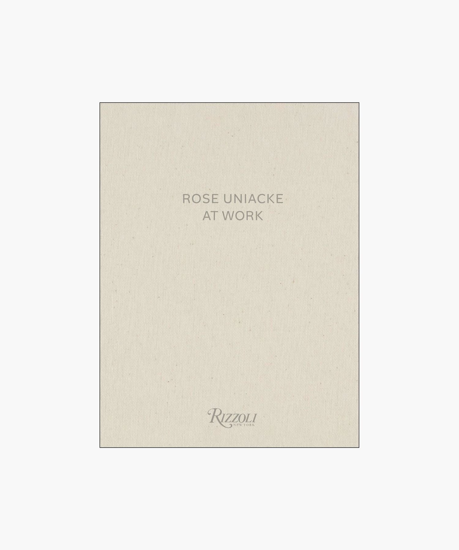 Cover of the book "Rose Uniacke at Work," featuring a minimalist design with beige fabric texture and gray text. | S.W. Home