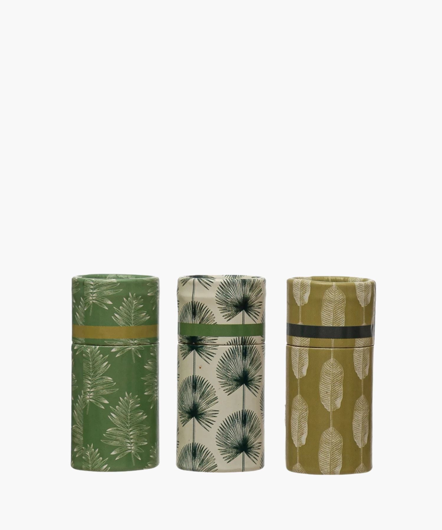 Three cylindrical Matchboxes with matches with botanical patterns on a white background. | SW Home