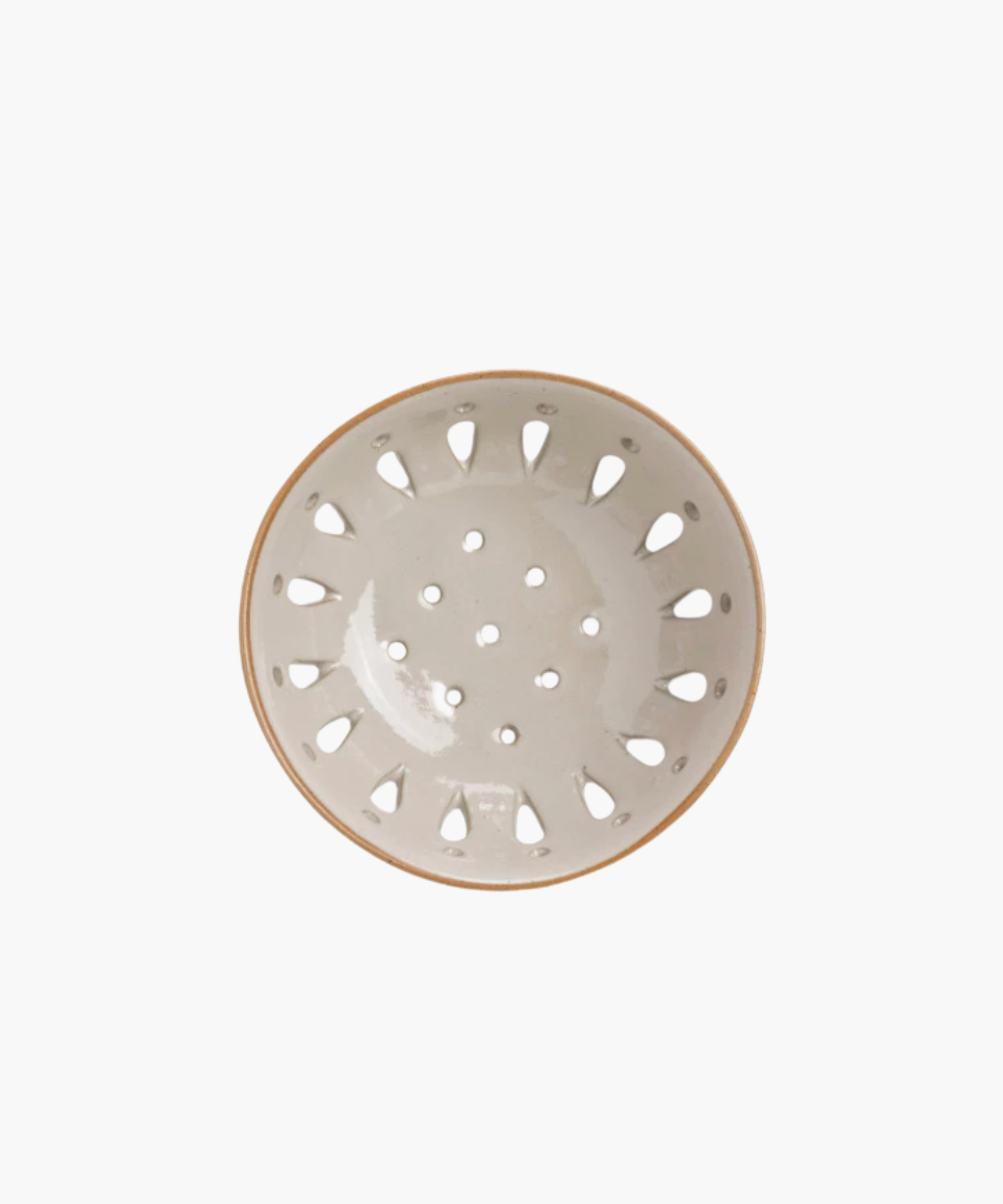 A beige ceramic colander with a light brown rim, featuring round holes and teardrop-shaped cutouts, standing out against a plain white background. | S.W. Home
