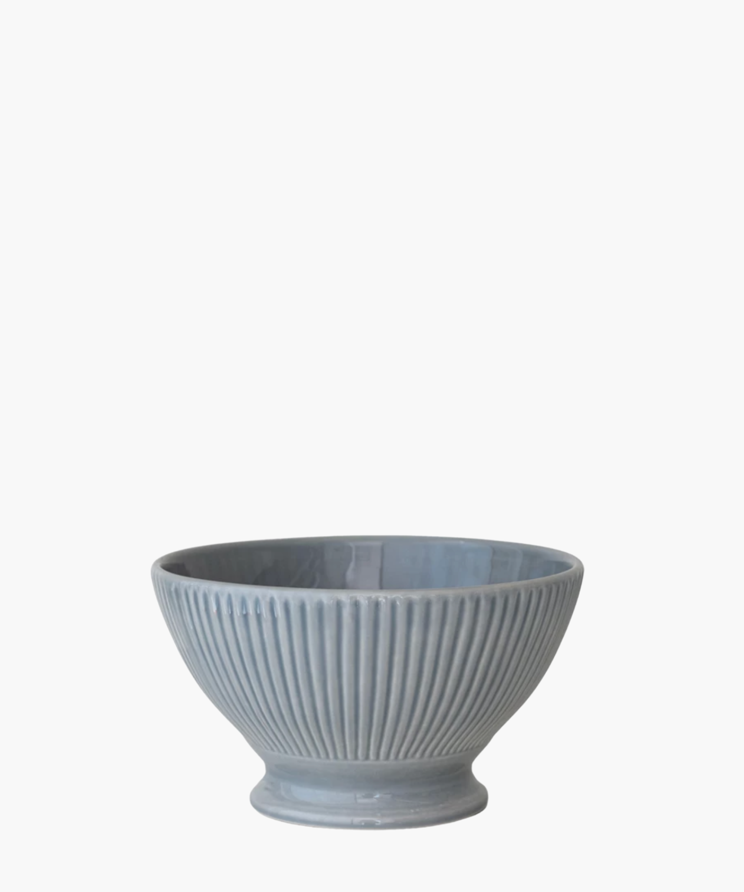 A ribbed, light blue ceramic bowl with a wide top and narrow base is centered against a white background, conveying a simple and elegant tone. | S.W. Home