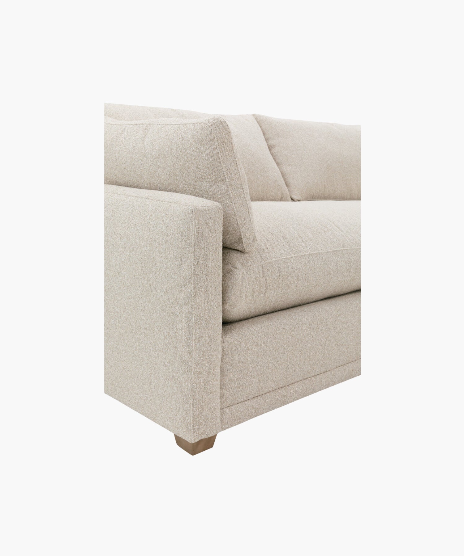 Close up of a beige sectional sofa on a white background. | SW Home