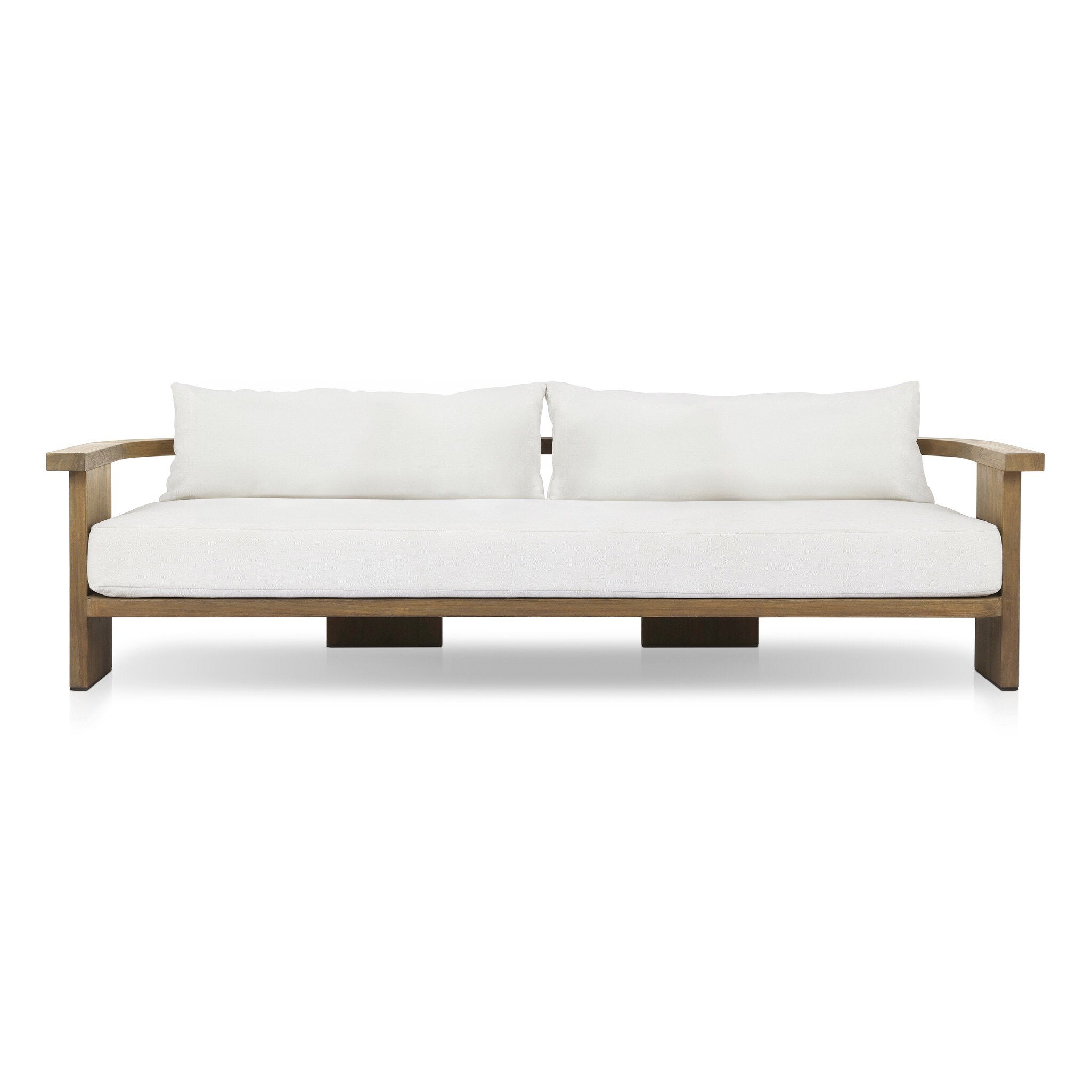 Outdoor sofa with curved wooden frame out of teak and white linen cushions on a white background. | S.W. Home