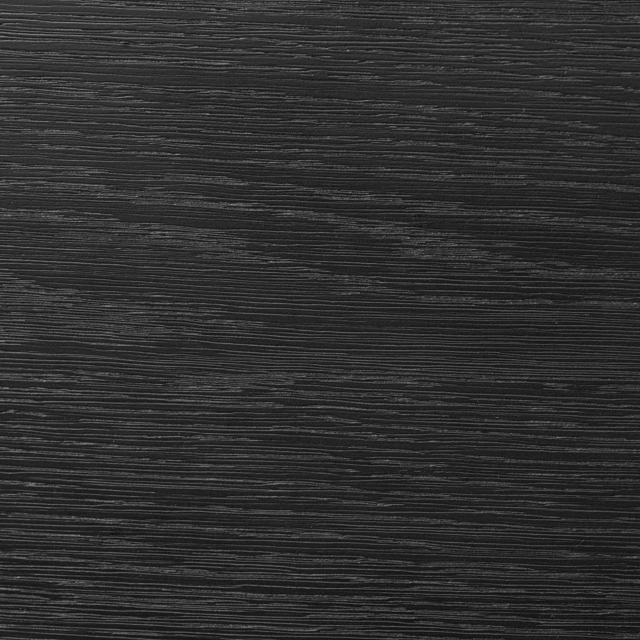 Close up of the dresser showing its matte black finish and wood grain. 