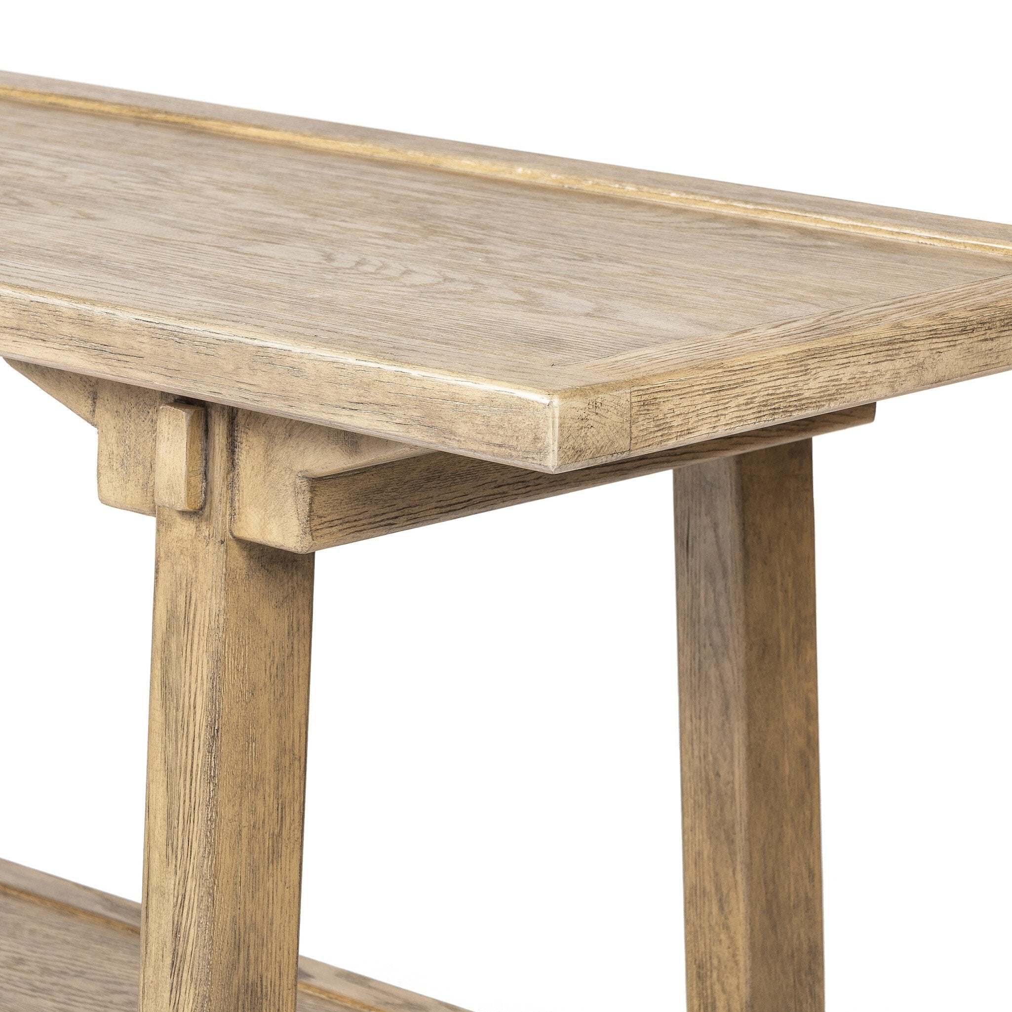 Close up of a wooden console table with a rustic finish on a white background.