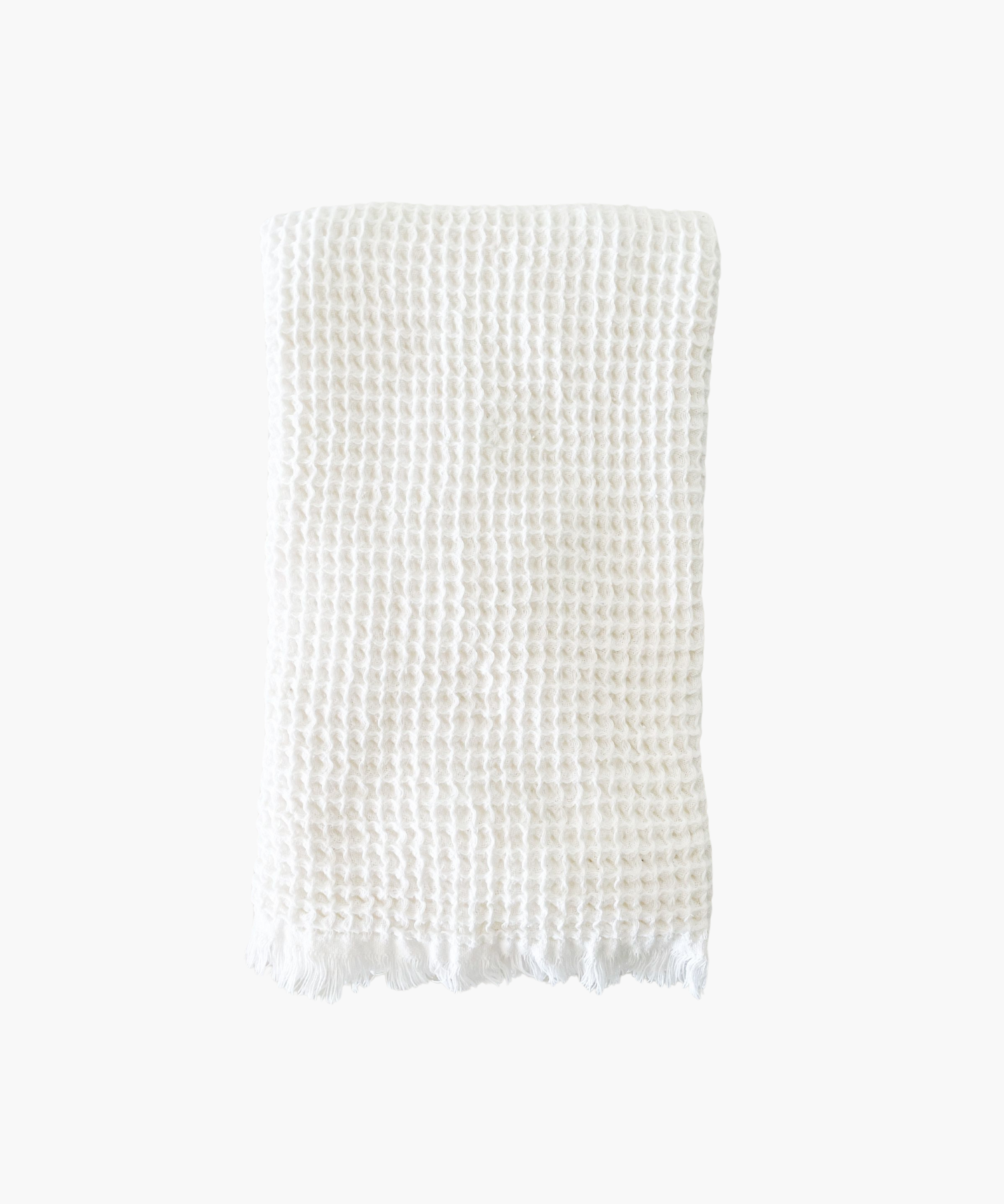 A gray Turkish cotton waffle bath towel with a fringe border. 