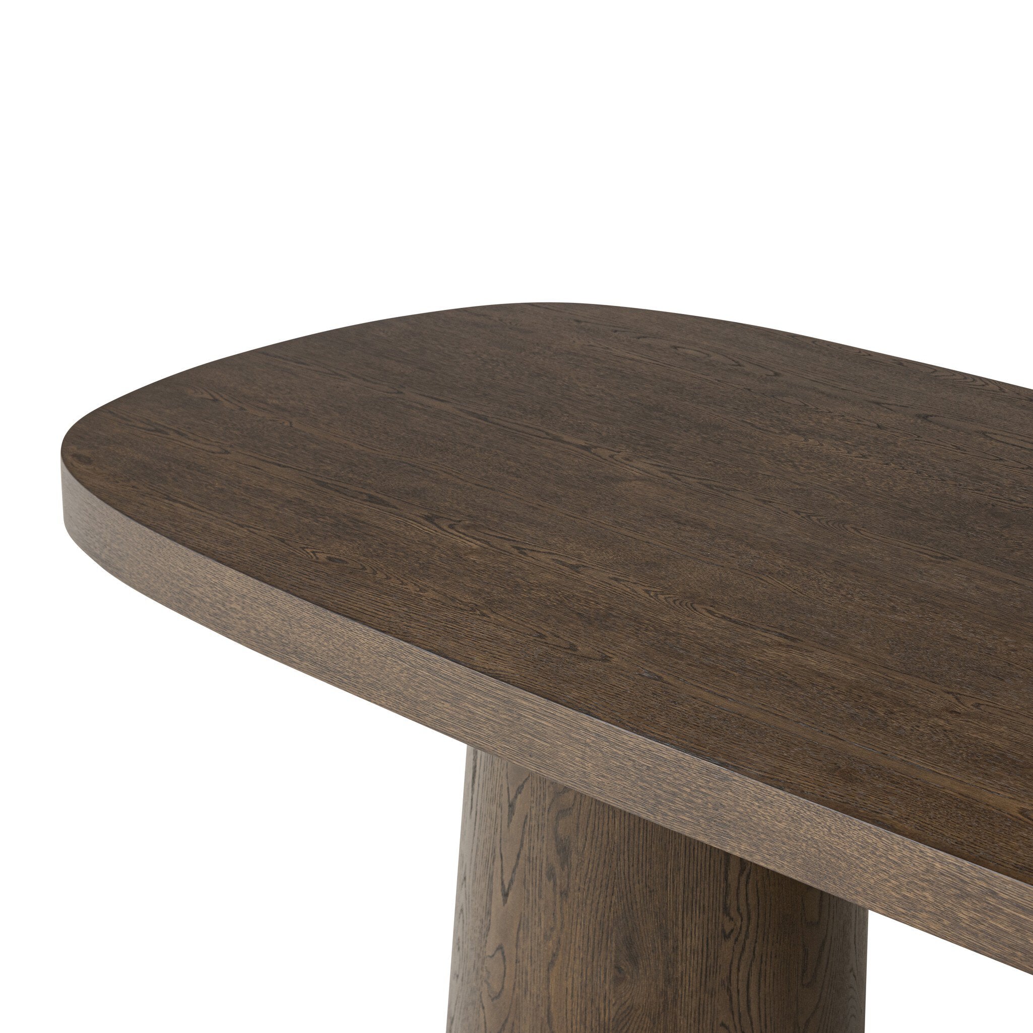 Close up of a wooden dining table with two cylindrical legs on a white background.