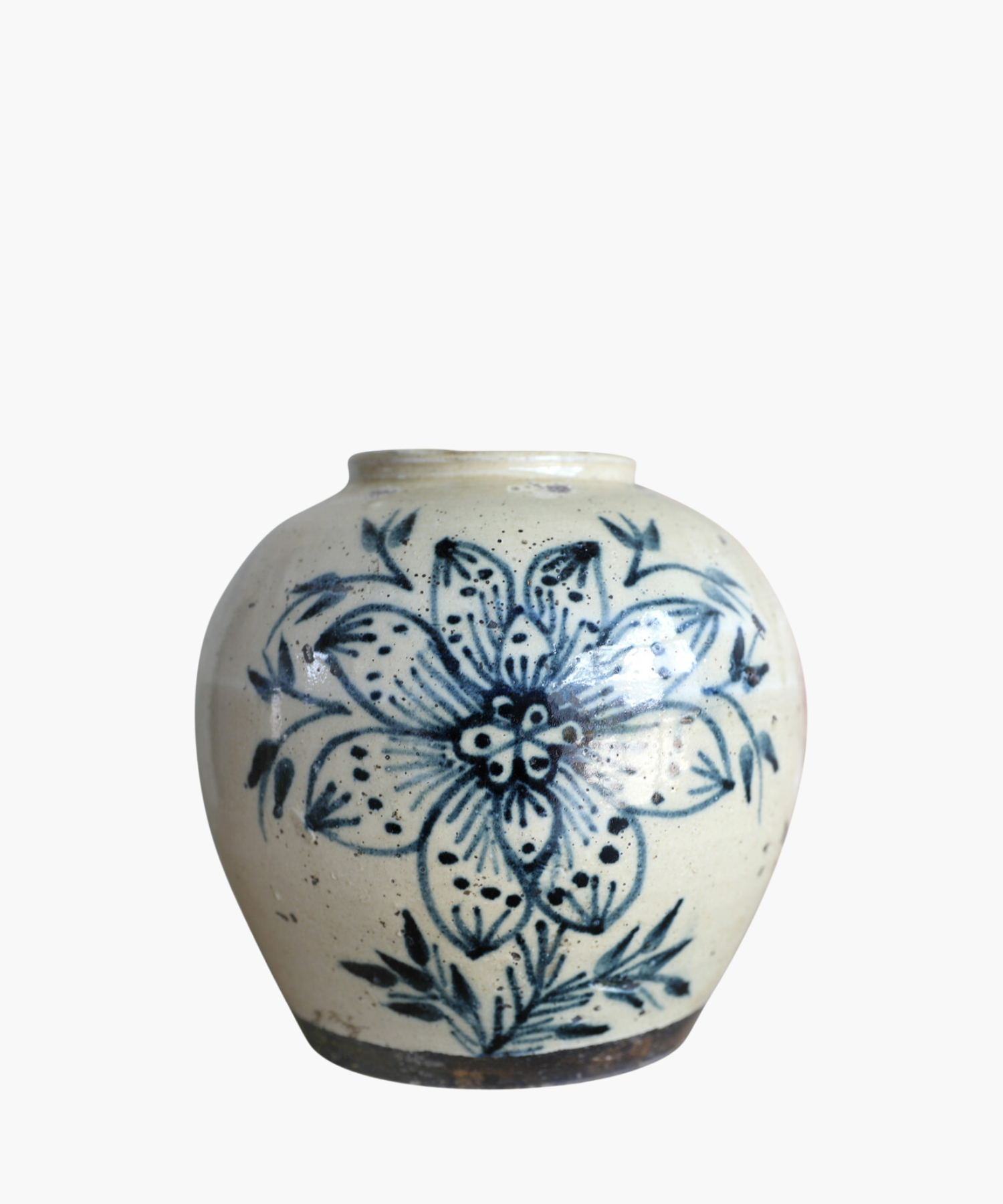A cream toned vintage vase features a large, intricate blue floral design with leaves. The style is traditional, conveying a rustic and artistic feel. | S.W. Home
