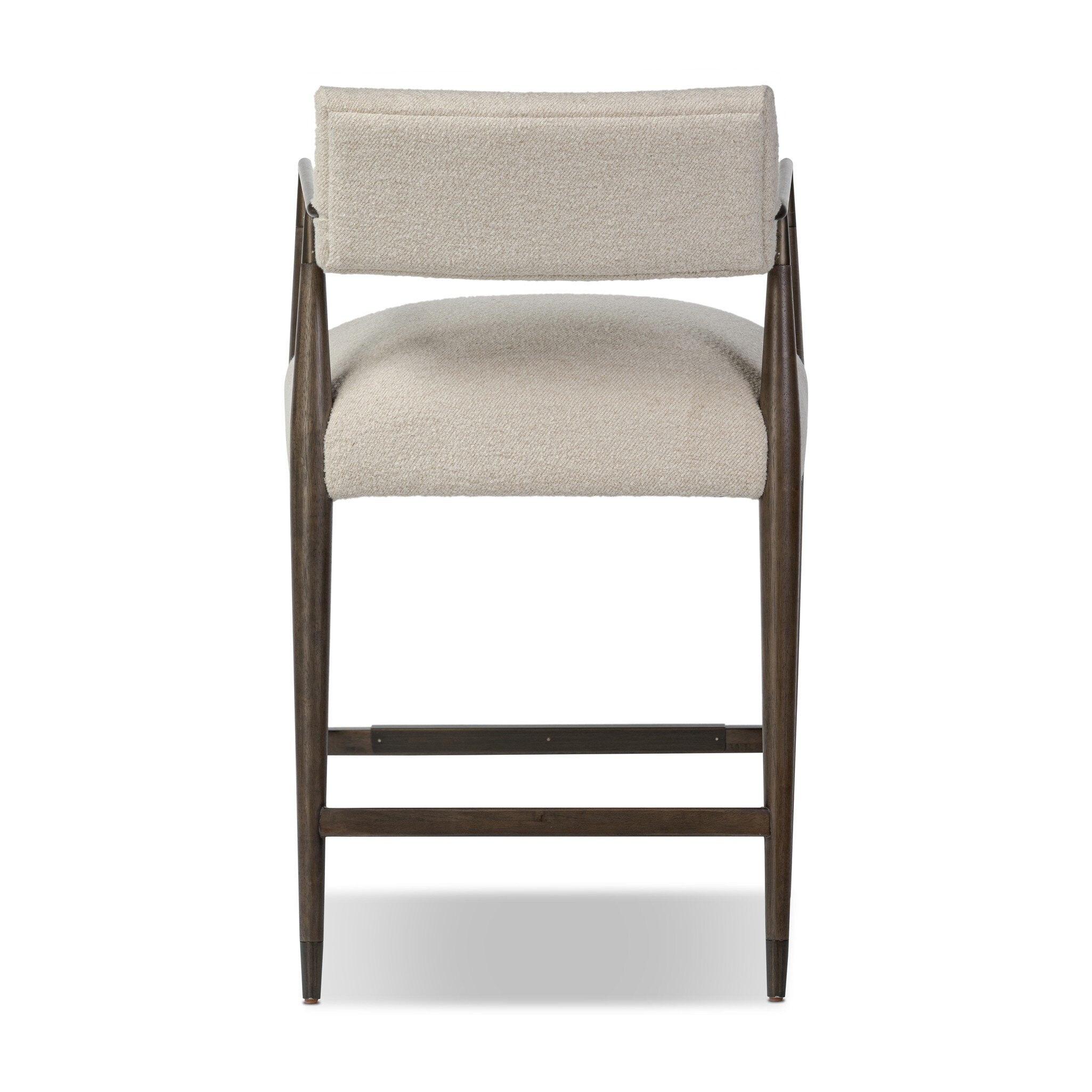 The back of a beige counter stool with wooden frame on a white background