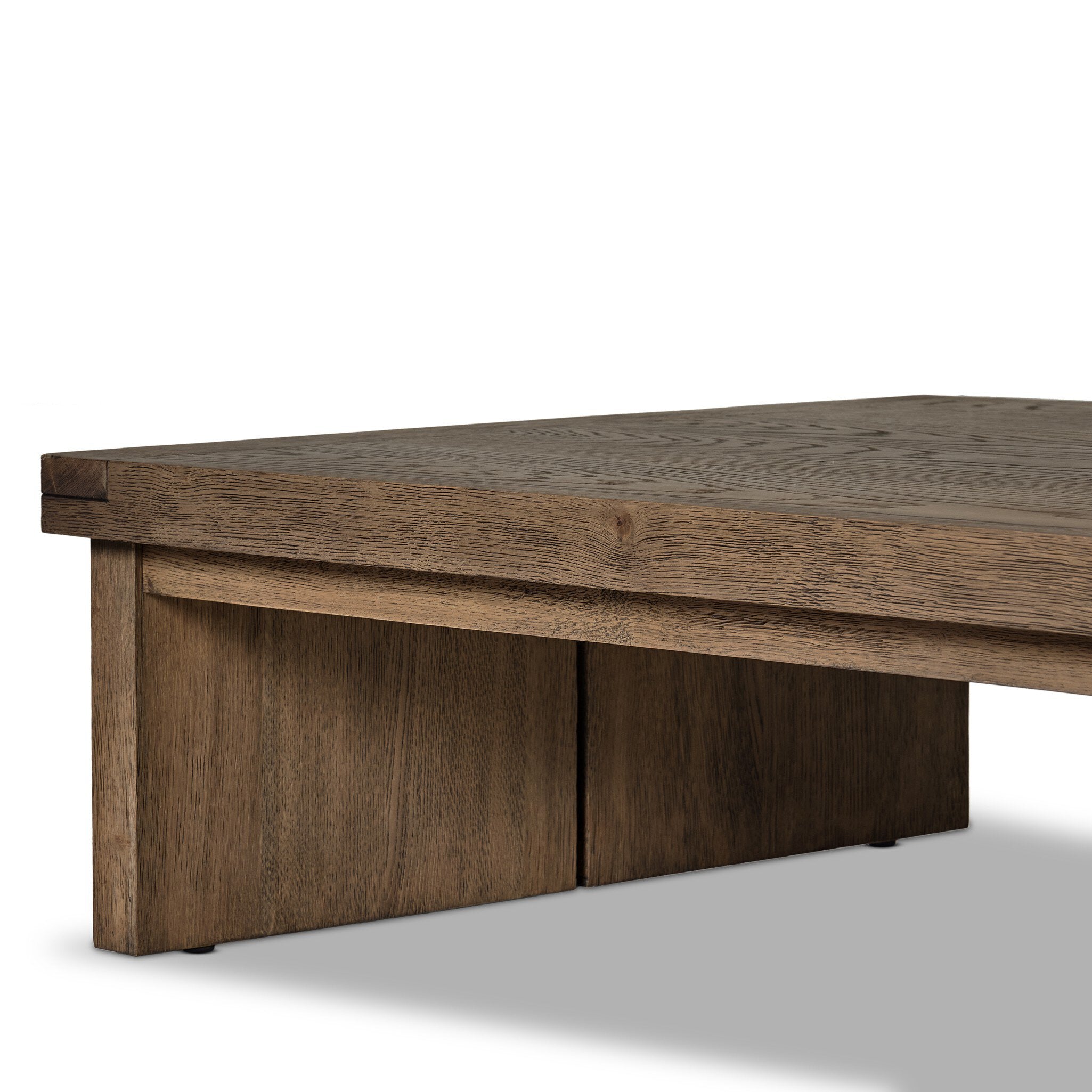 Close up of an oak coffee table on a white background.