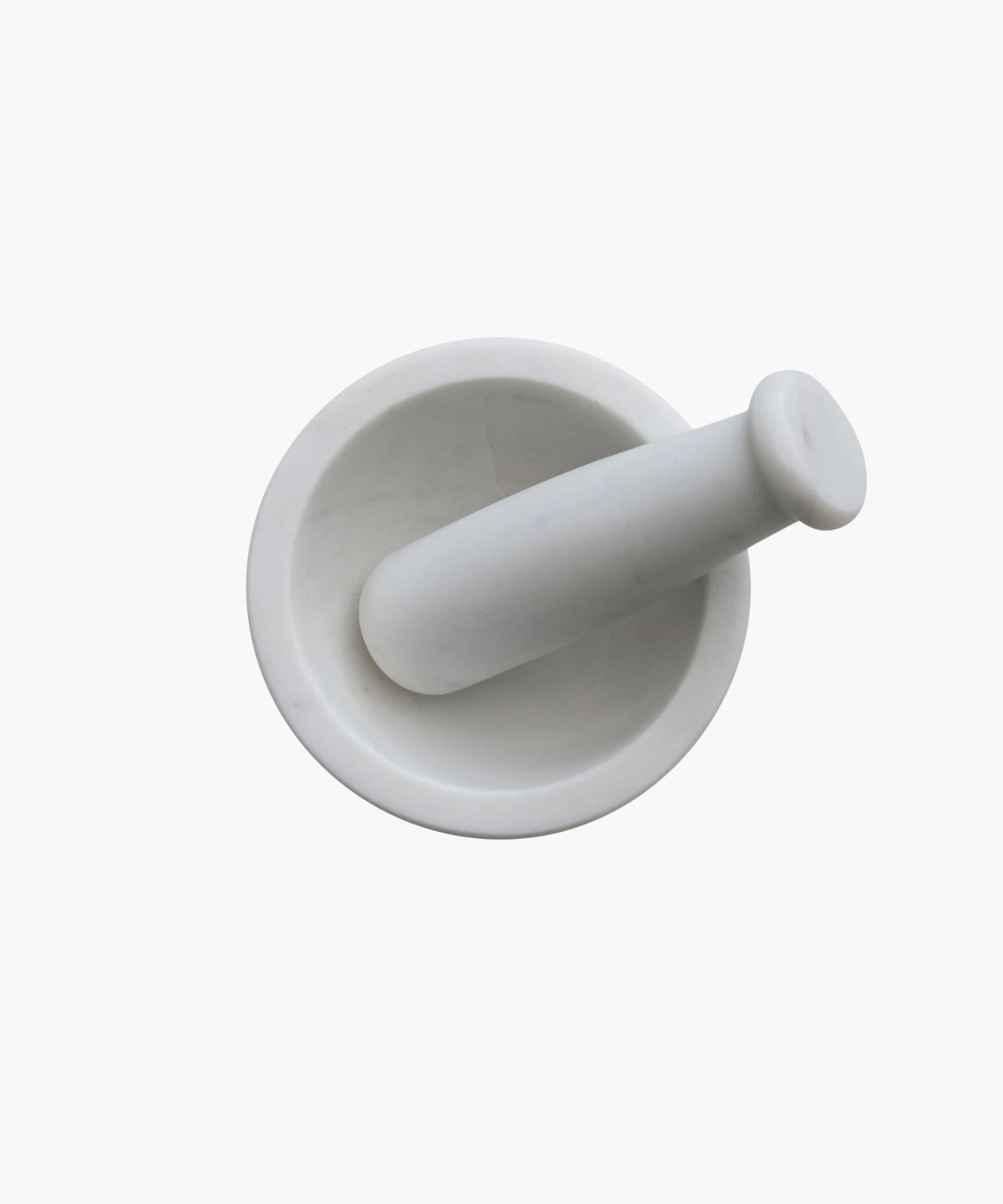 An overhead view of a white marble mortar and pestle set on a plain background. The smooth, round design conveys a sense of elegance and simplicity, ideal for grinding. | Wildwood Home Co.