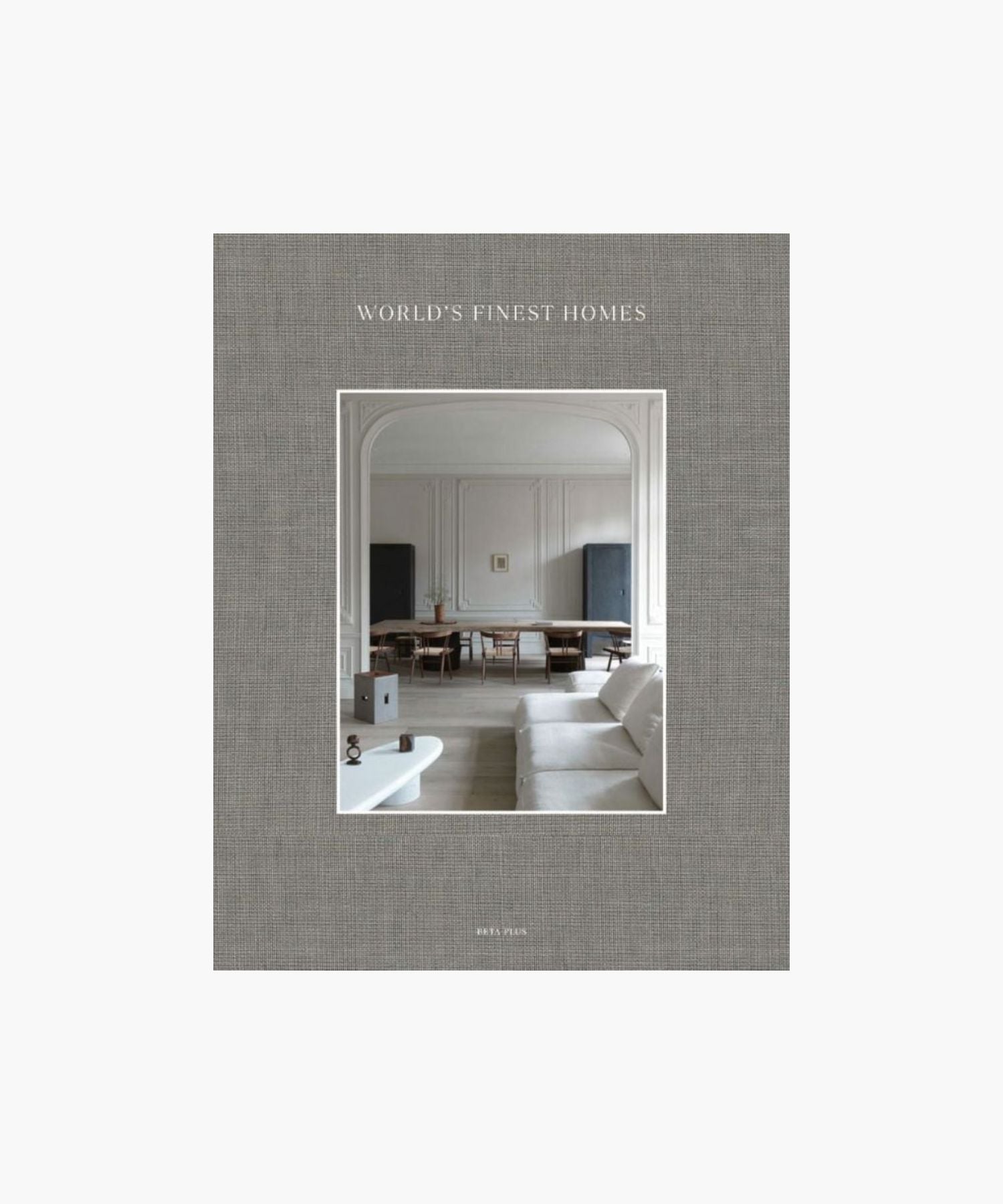 The cover of the book "World's Finest Homes" by Wim Pauwels features a minimalist living room. A neutral palette with a white sofa, elegant wood dining table, and soft lighting. | S.W. Home