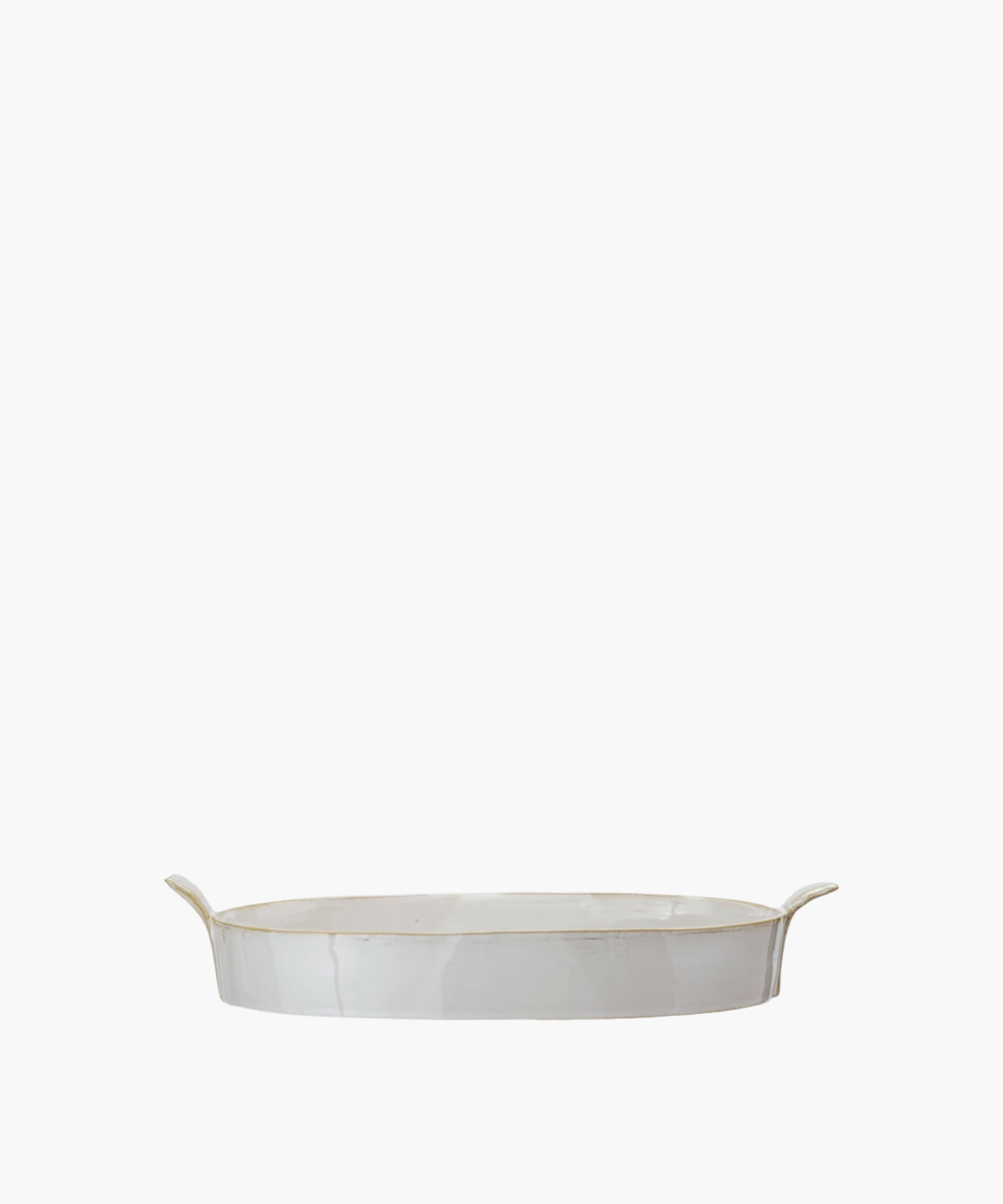 Oval white ceramic stoneware baker with slightly raised, flared handles on each end. The baker has a glossy finish, conveying a minimalist, elegant design. | S.W. Home