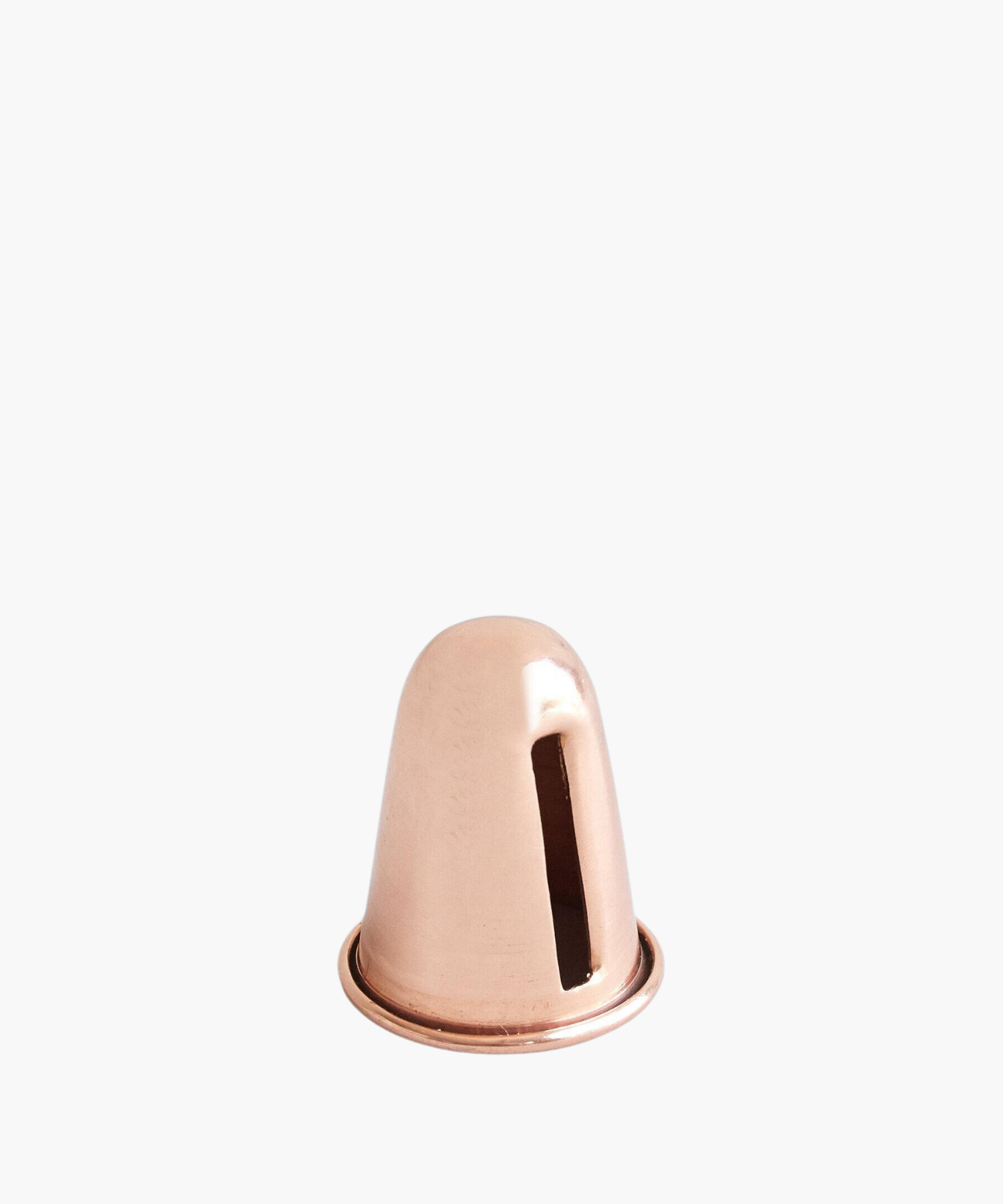 A solid copper candle sharpener with a tapered slot for shaping candles. | SW Home