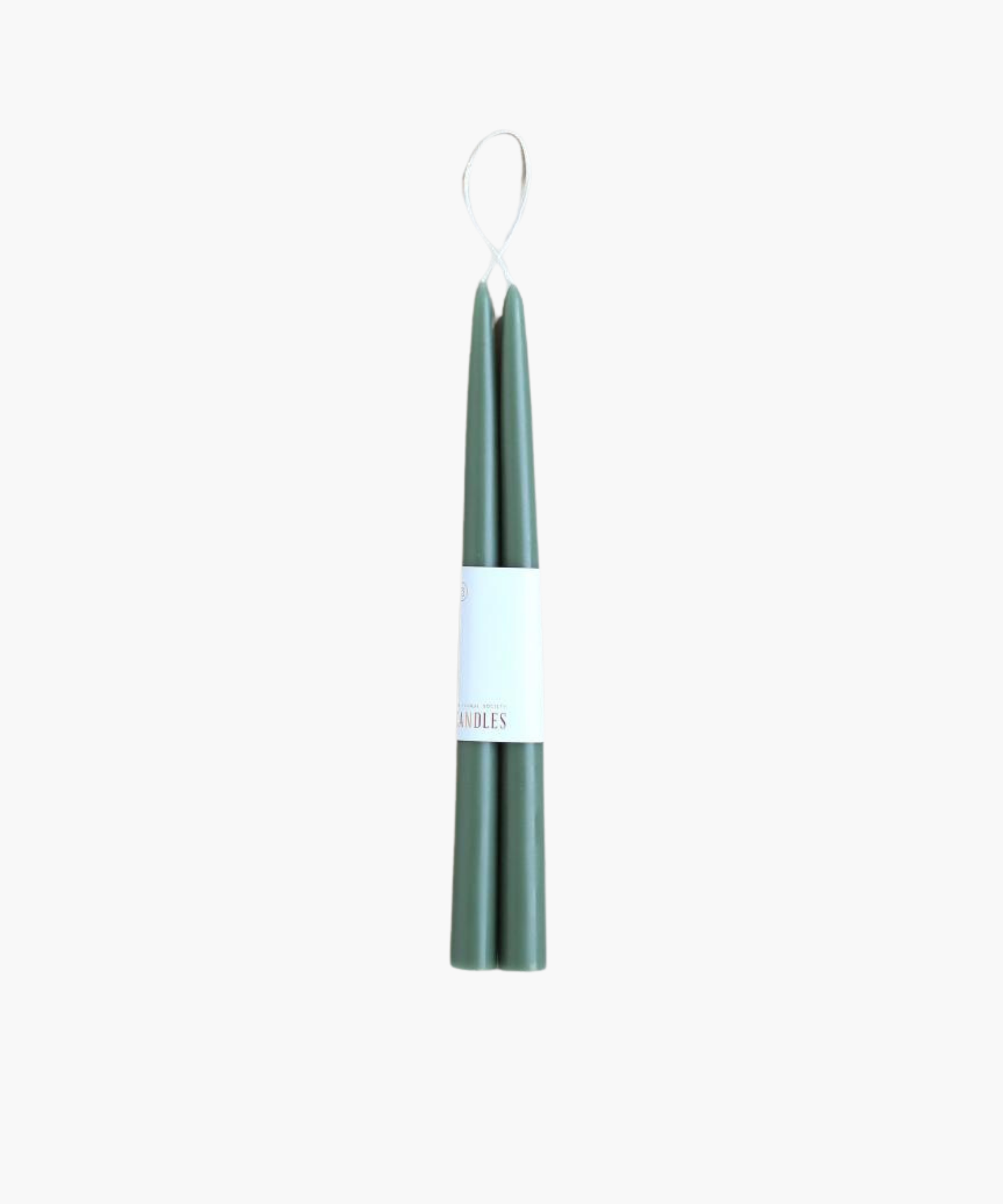 Two green, tapered candles bundled together with a white label. The candles are sleek and elegant, conveying a sense of calm and simplicity. | SW Home